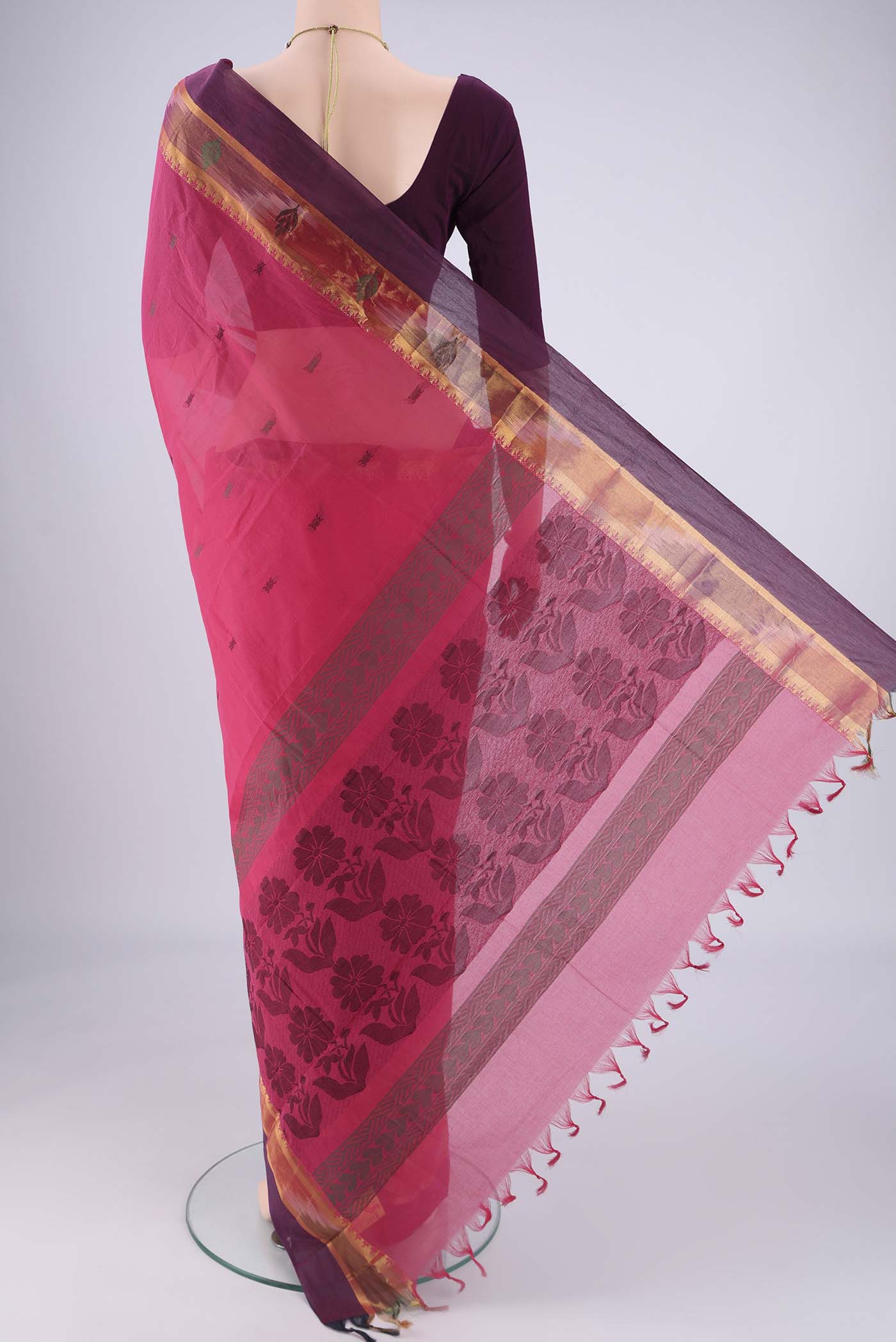 Flat view of Pink Kanchi Cotton Saree with Thread Butta on the body and Zari Border. 