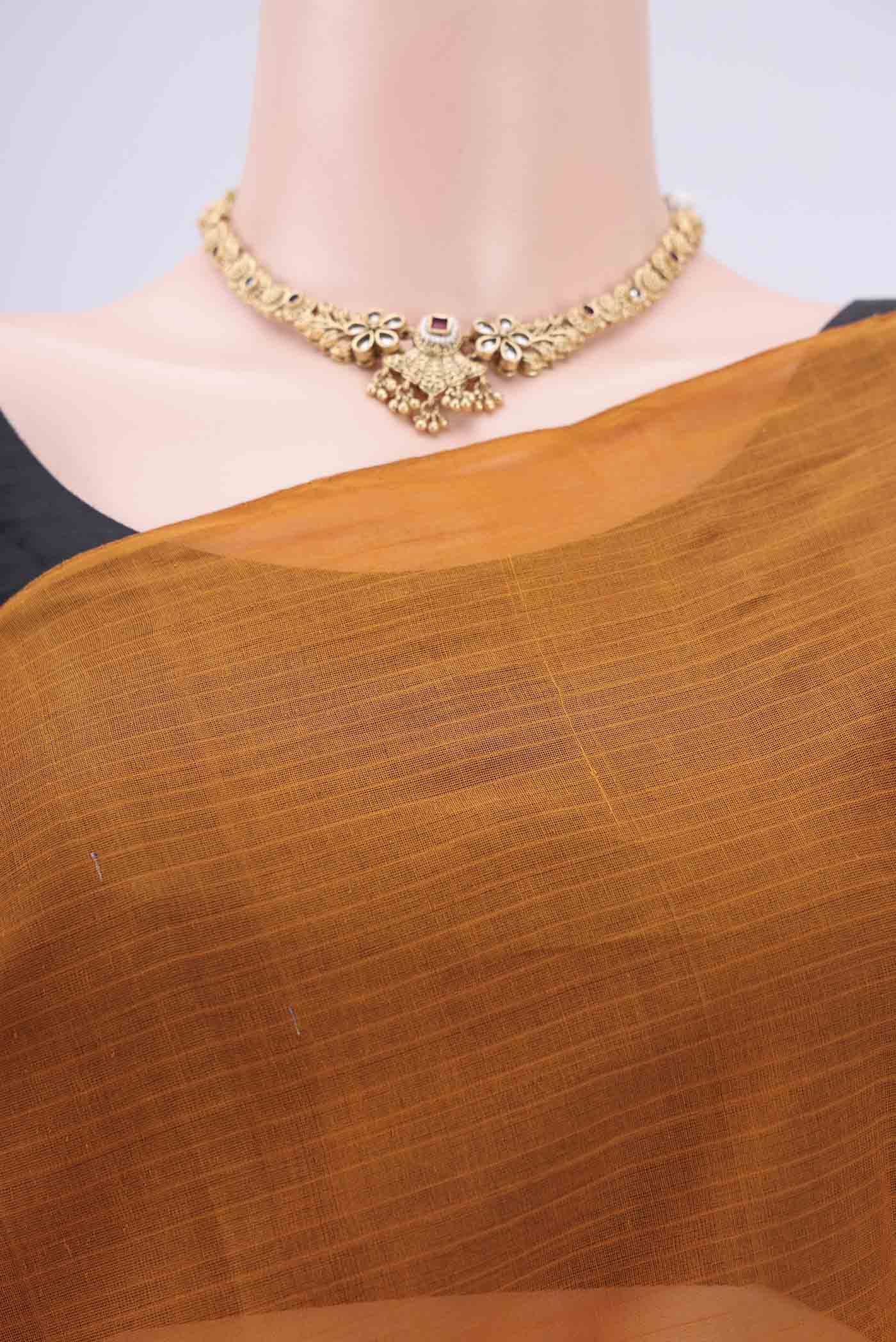 Border image of Mustard Kanchi Cotton Saree with Checked design on the body and Zari Border. 