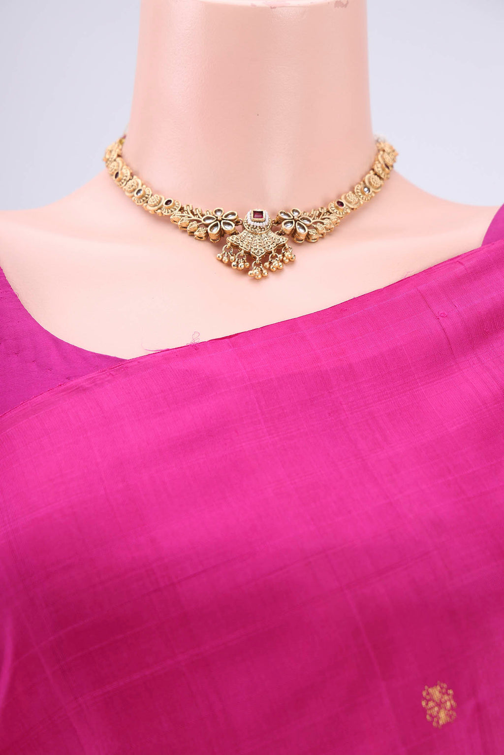 Border image of Rani Pink Kanjivaram Silk Saree with Zari Butta on the body and Zari Border. 