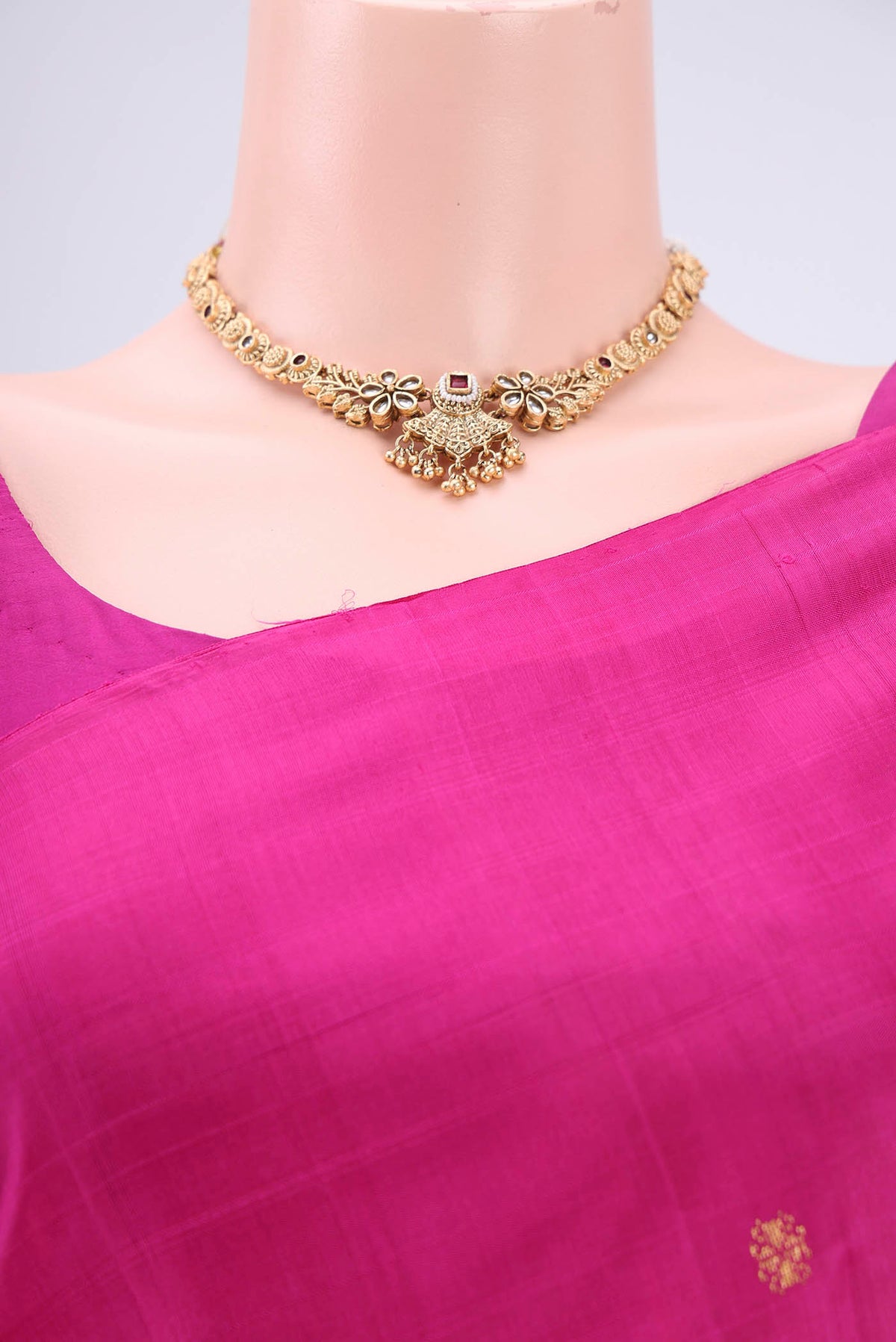Border image of Rani Pink Kanjivaram Silk Saree with Zari Butta on the body and Zari Border. 