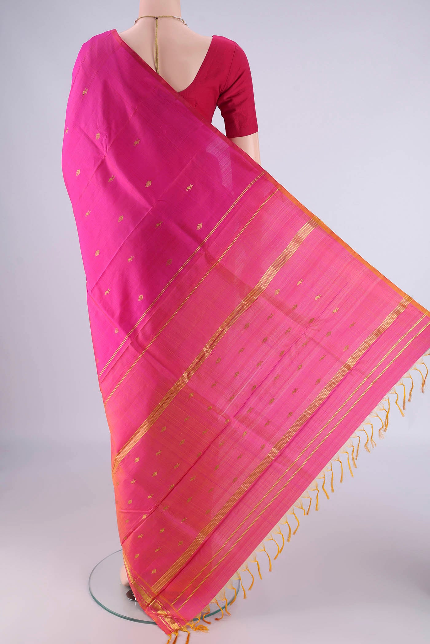 Flat view of Pink Kanjivaram Silk Saree with Zari Butta on the body and One Side Border. 
