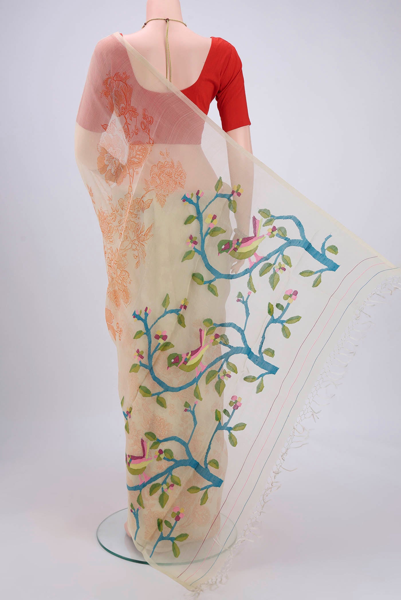 Flat view of Cream Organza Silk Saree with Printed design on the body and Without Border. 