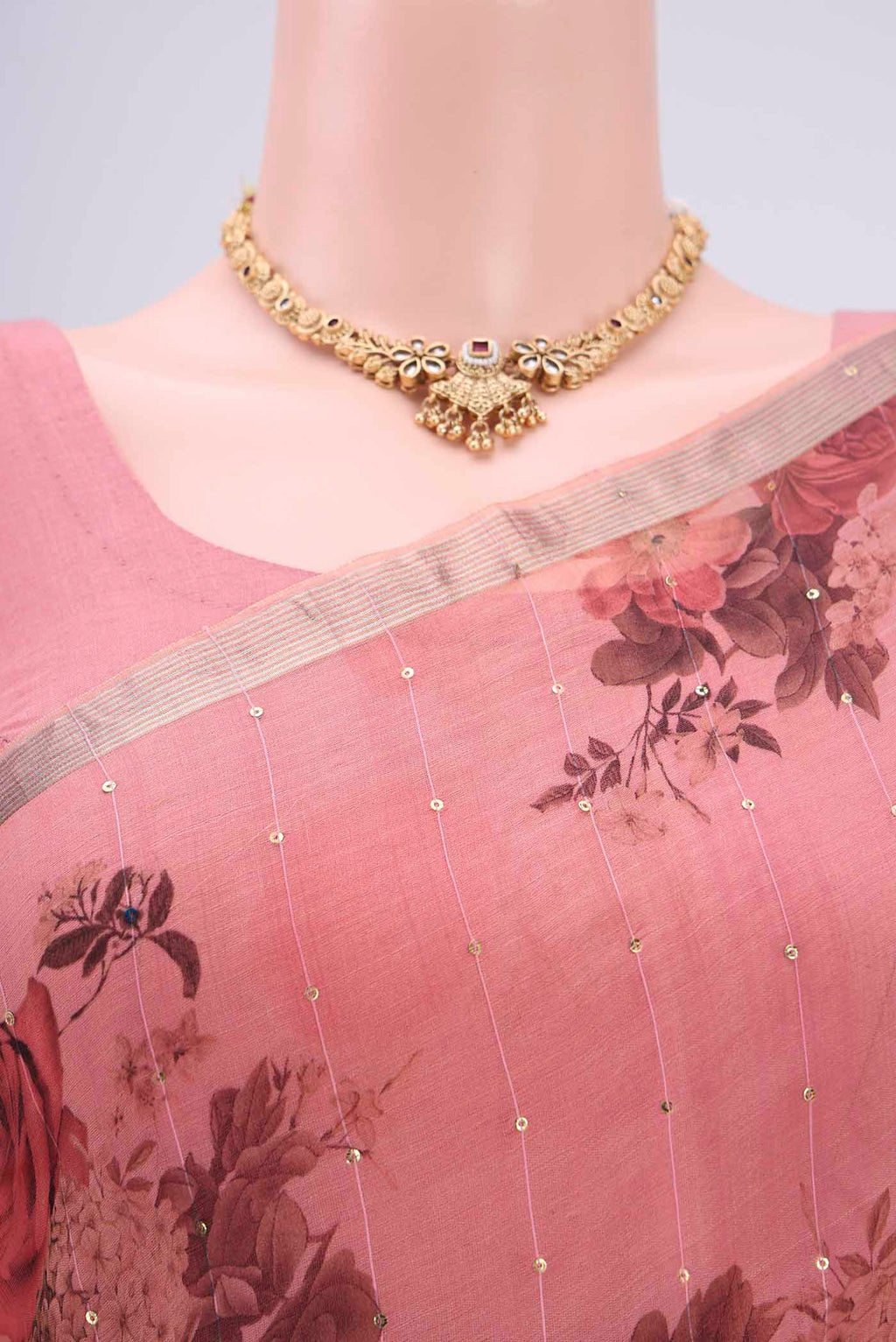 Border image of Coral Organza Silk Saree with Printed design on the body and Zari Border. 