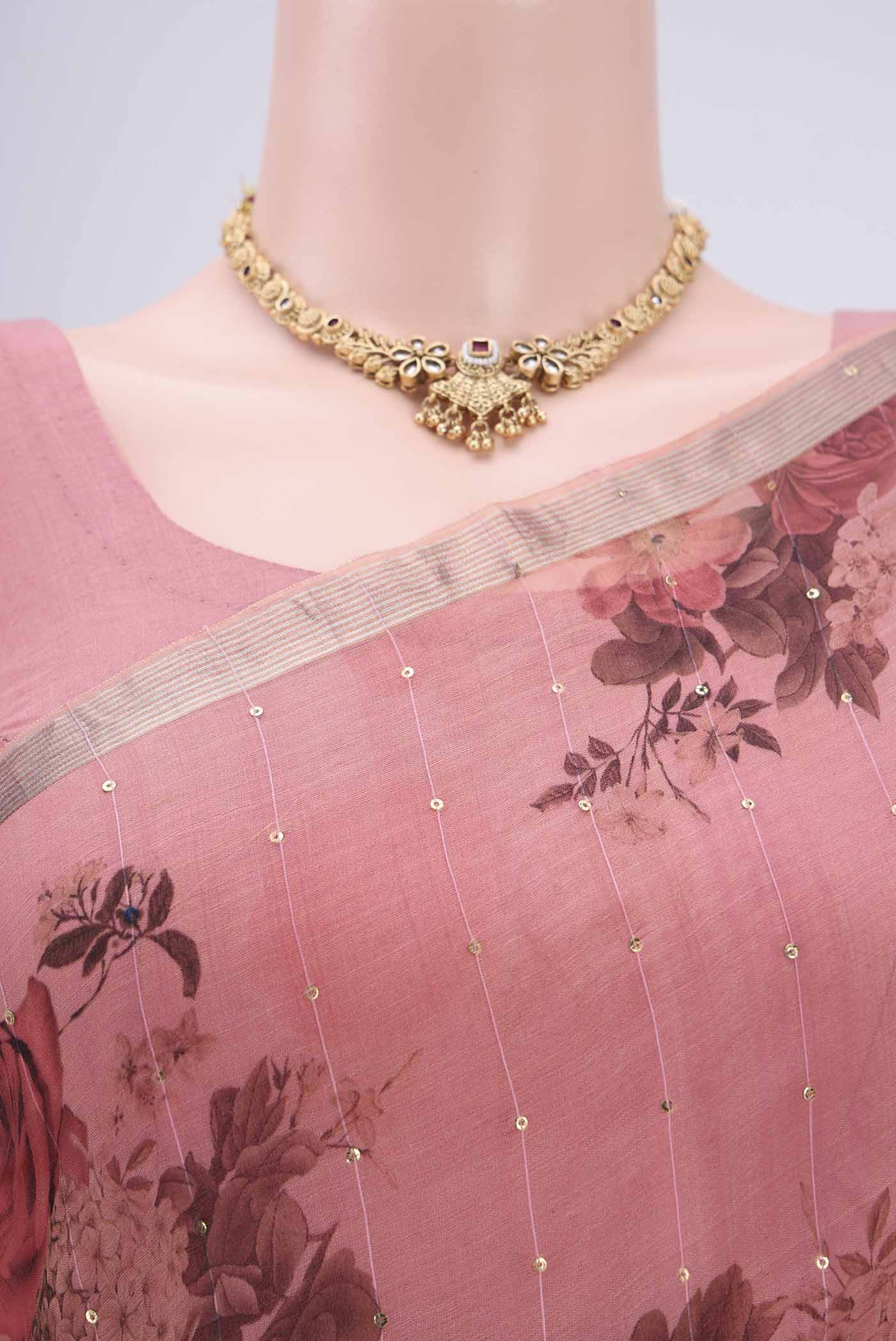 Border image of Coral Organza Silk Saree with Printed design on the body and Zari Border. 