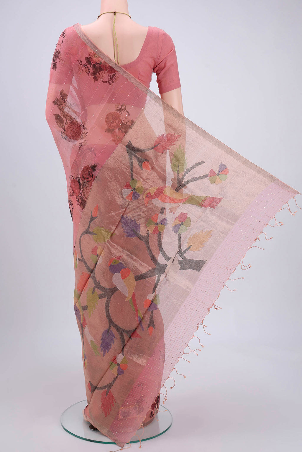 Flat view of Coral Organza Silk Saree with Printed design on the body and Zari Border. 
