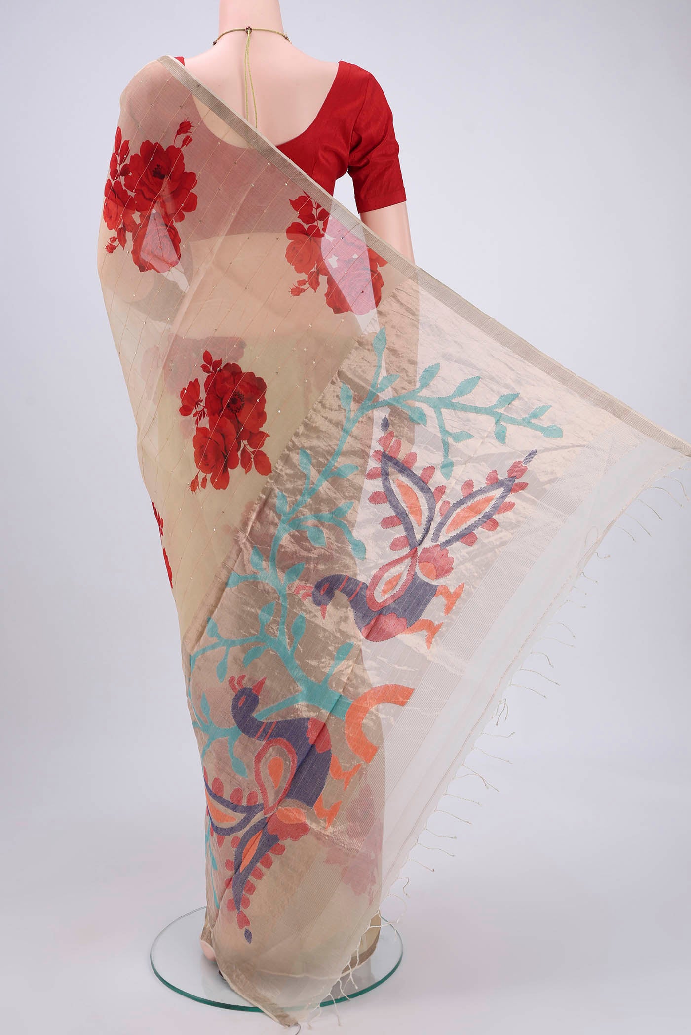 Flat view of Beige Organza Silk Saree with Printed design on the body and Zari Border. 
