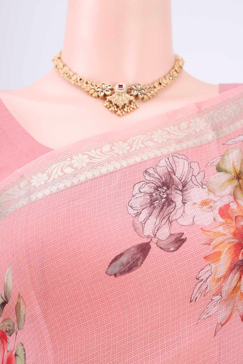 Border image of Peach Kota Silk Saree with Printed design on the body and Zari Border. 
