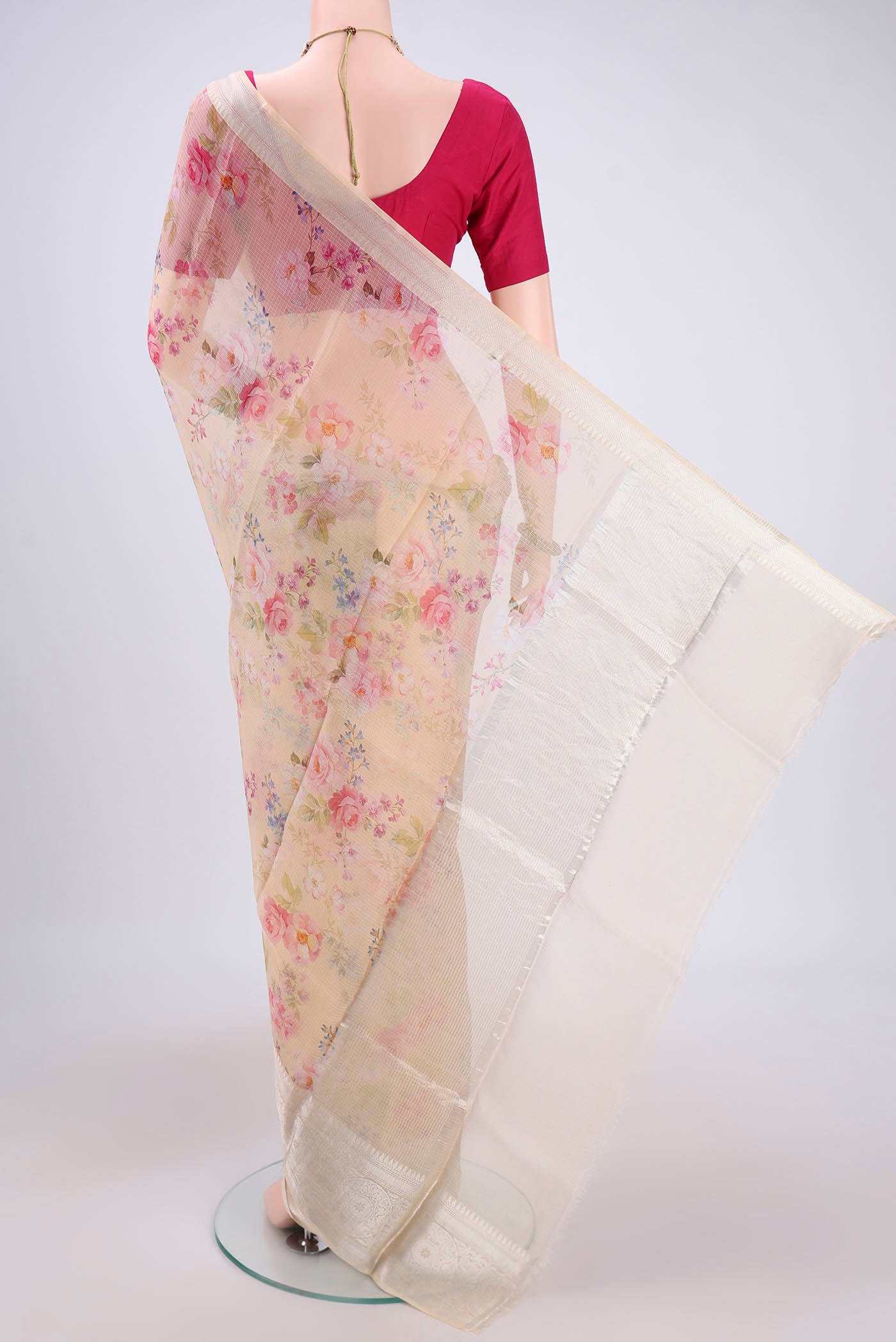 Flat view of Cream Kota Silk Saree with Floral Print on the body and Zari Border. 