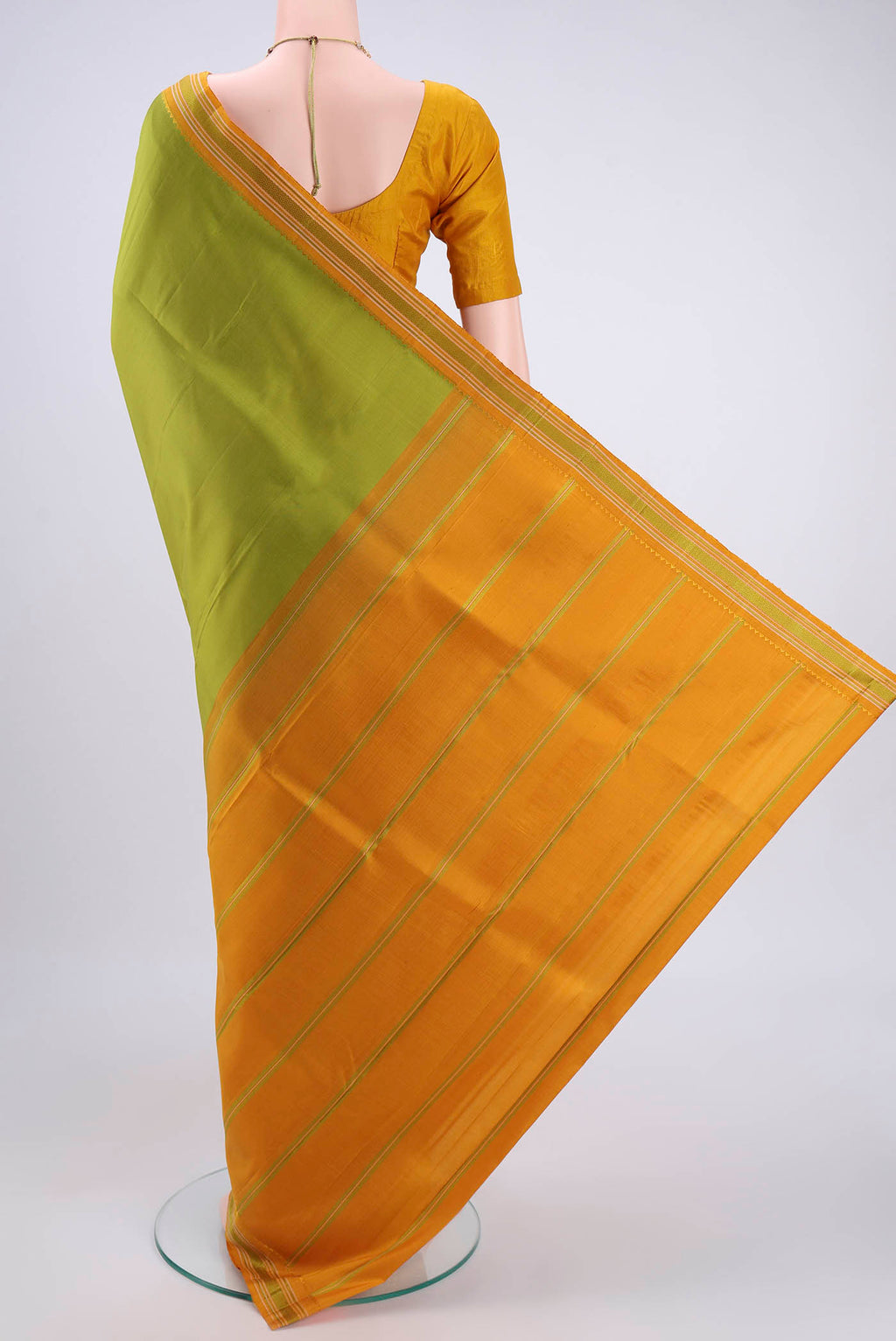 Flat view of Light Green Kanjivaram Silk Saree with Plain Body and Thread Border. 
