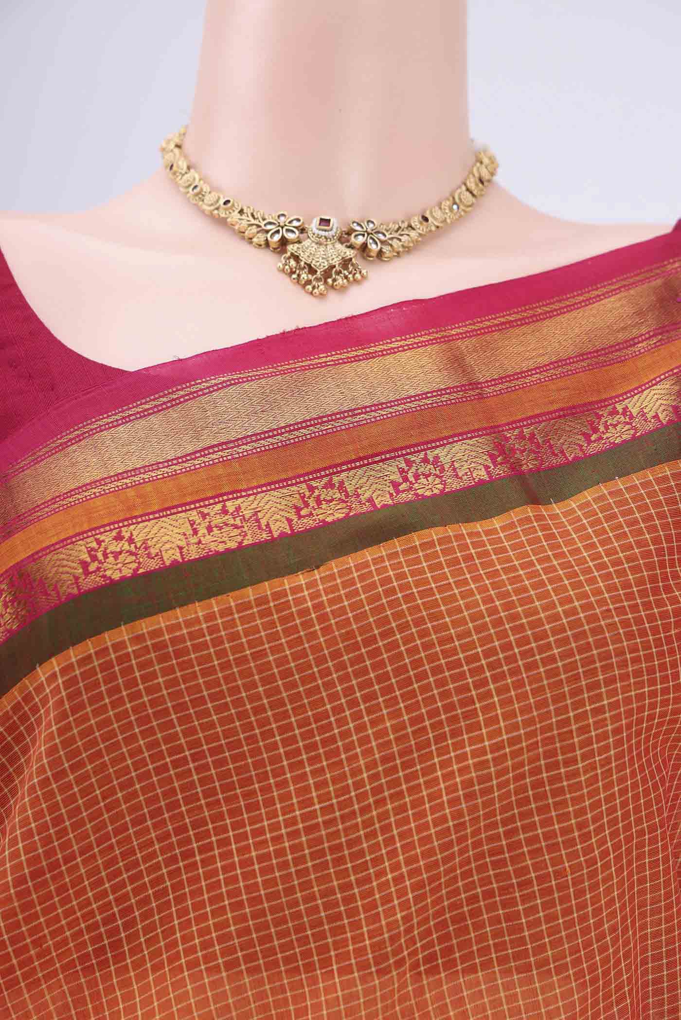 Border image of Brick Orange Dual Tone Gadwal Silk Cotton Saree with Checked design on the body and Silk Border. 