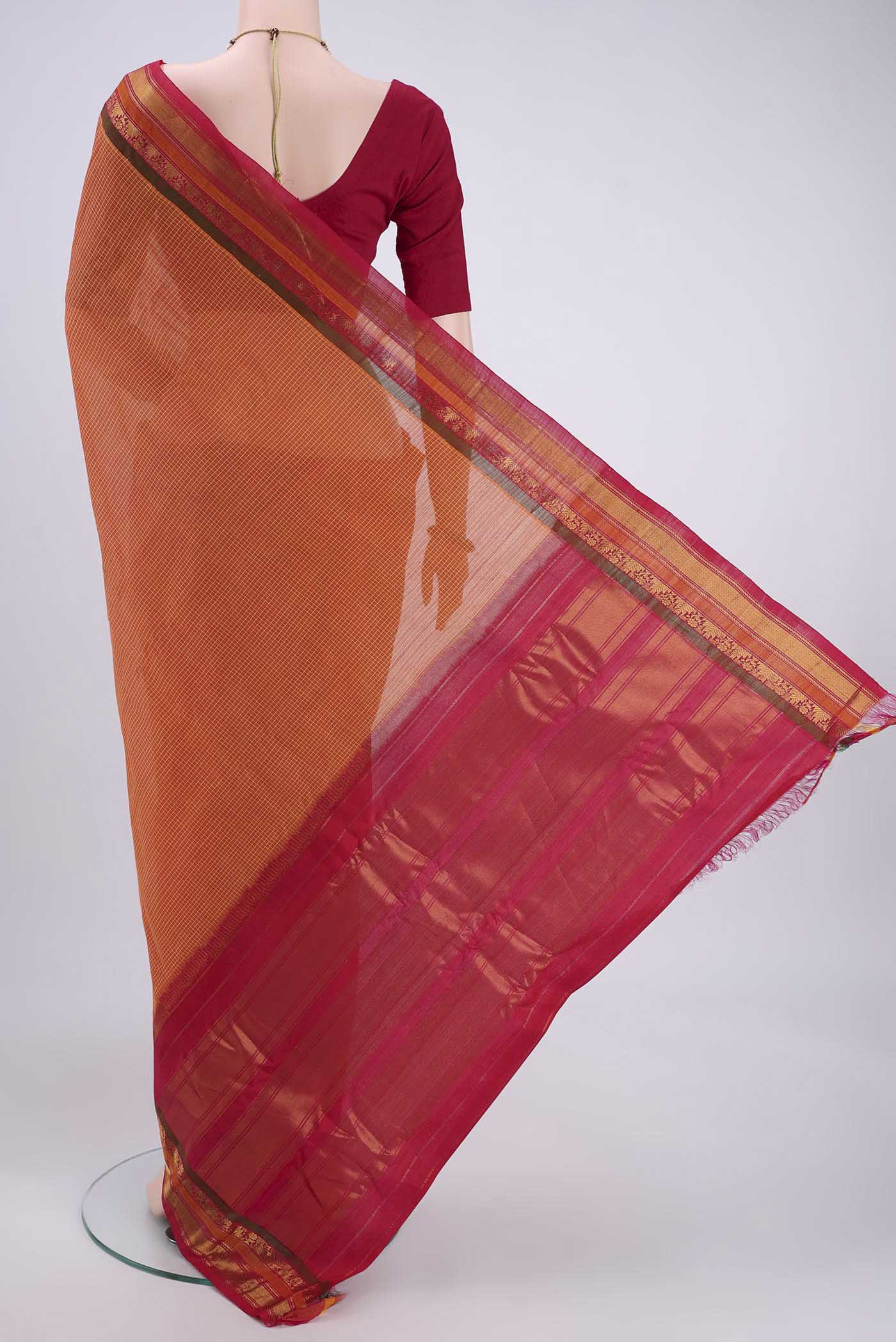 Flat view of Brick Orange Dual Tone Gadwal Silk Cotton Saree with Checked design on the body and Silk Border. 