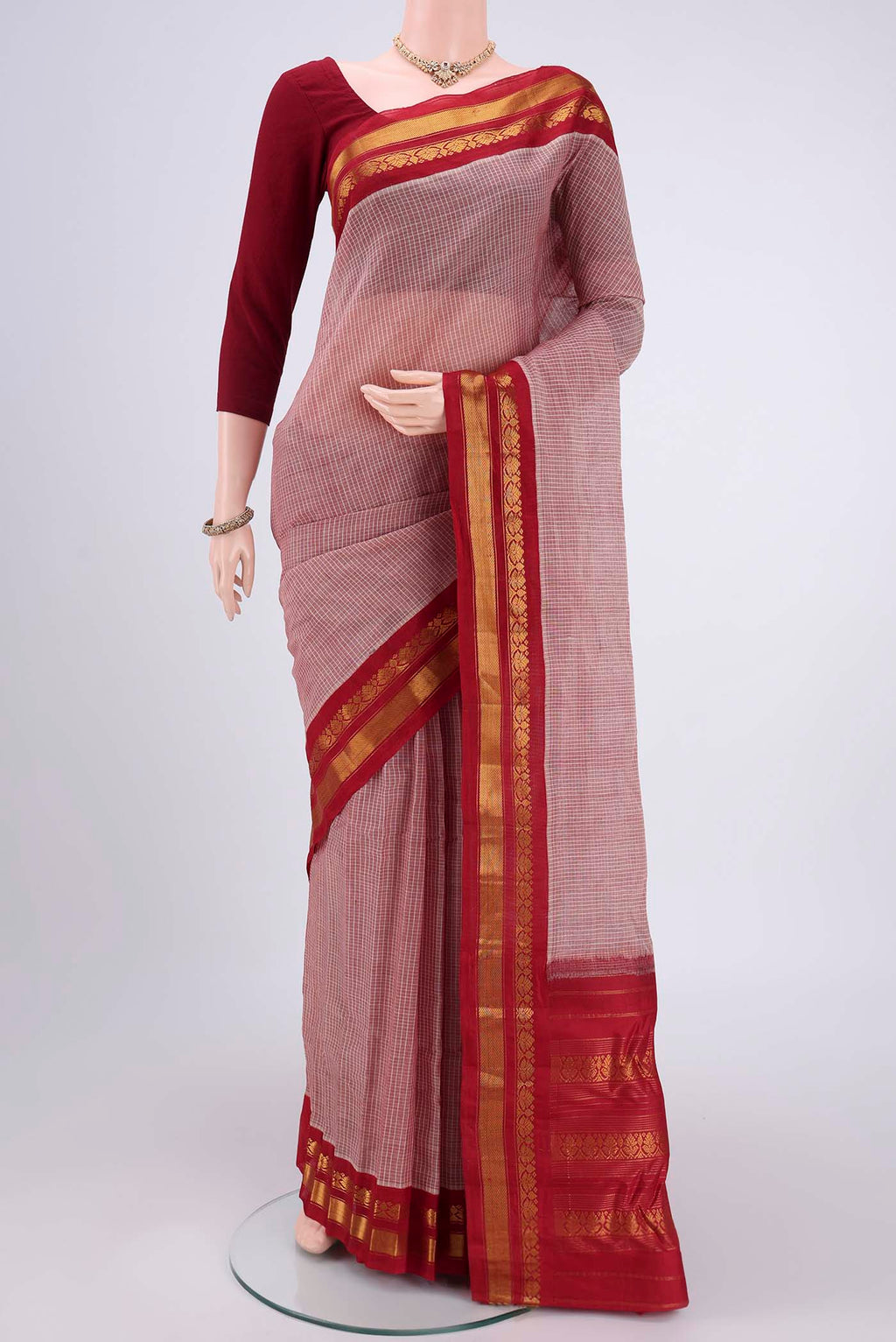 Coral Dual Tone Gadwal Silk Cotton Saree with Checked design on the body and Silk Border.  displayed on a mannequin