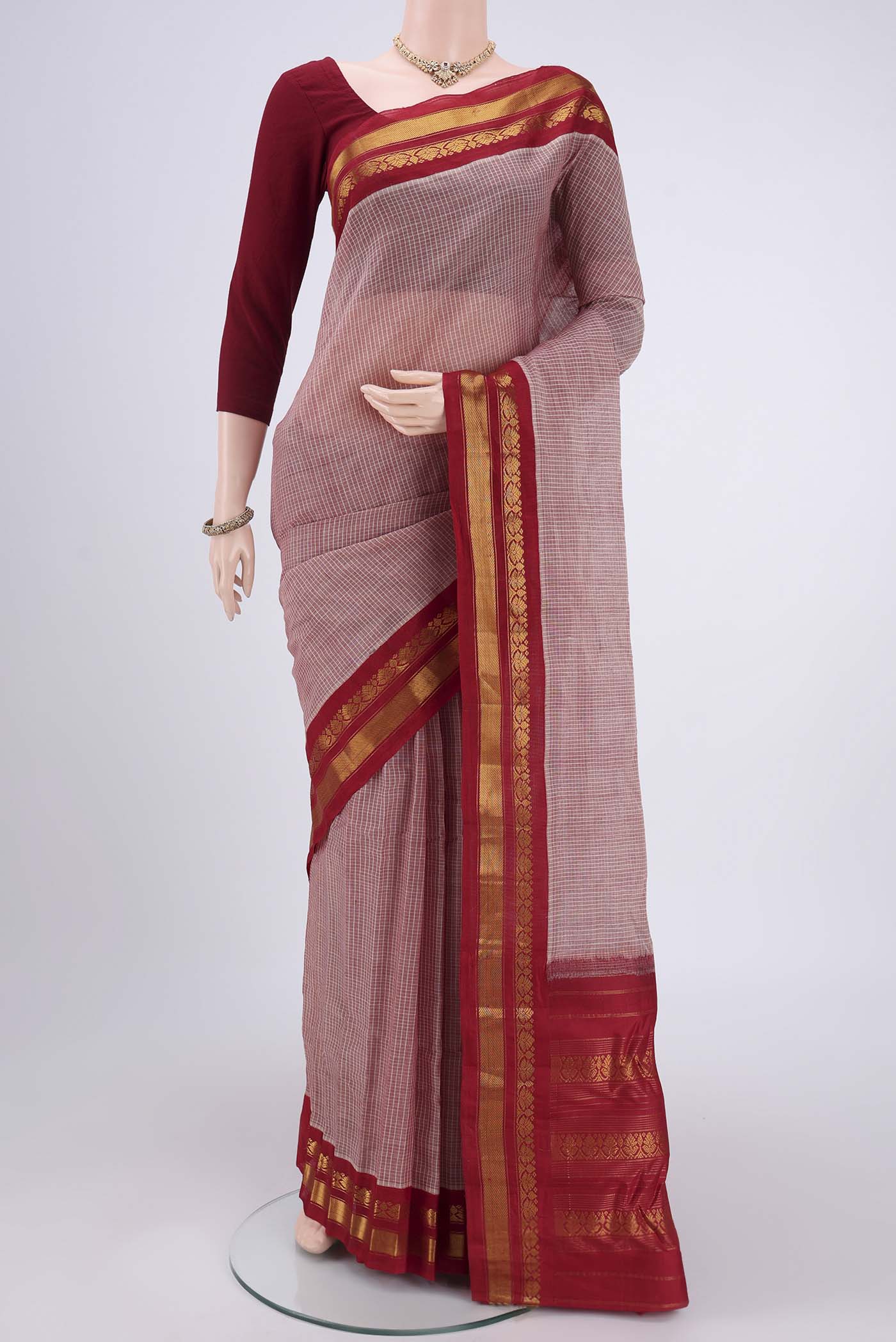 Coral Dual Tone Gadwal Silk Cotton Saree with Checked design on the body and Silk Border.  displayed on a mannequin
