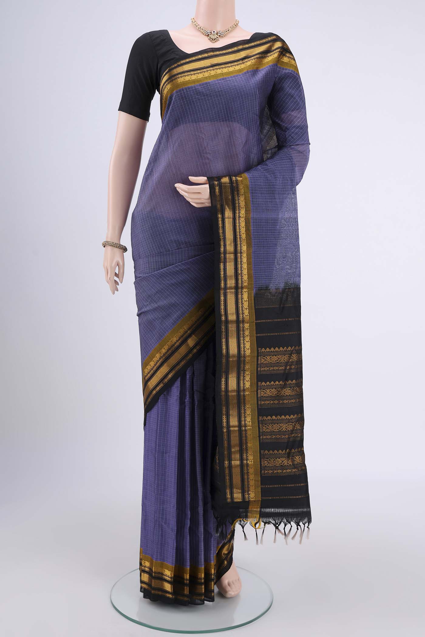Dark Mauve Gadwal Silk Cotton Saree with Checked design on the body and Silk Border.  displayed on a mannequin