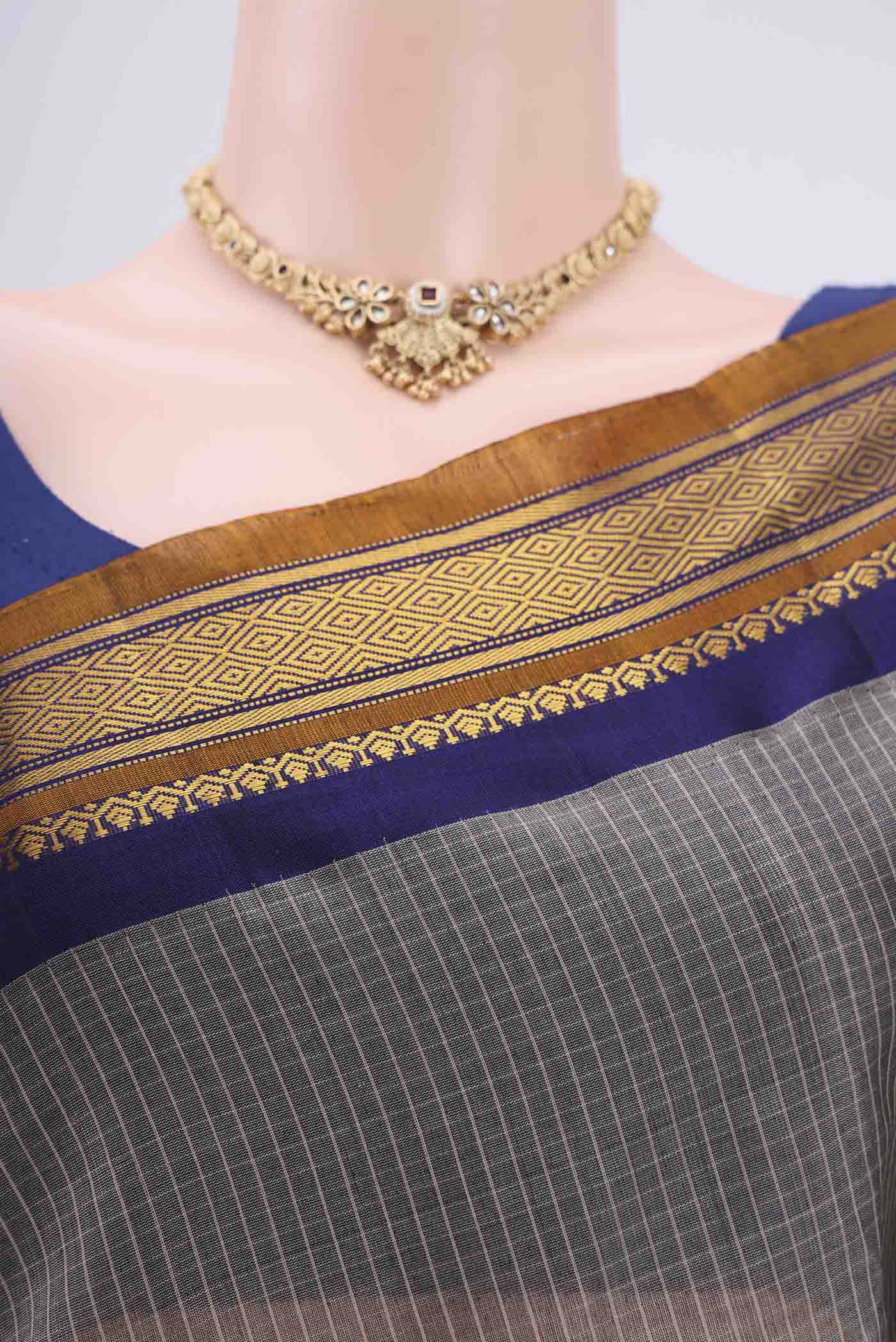 Border image of Grey Gadwal Silk Cotton Saree with Checked design on the body and Zari Border. 