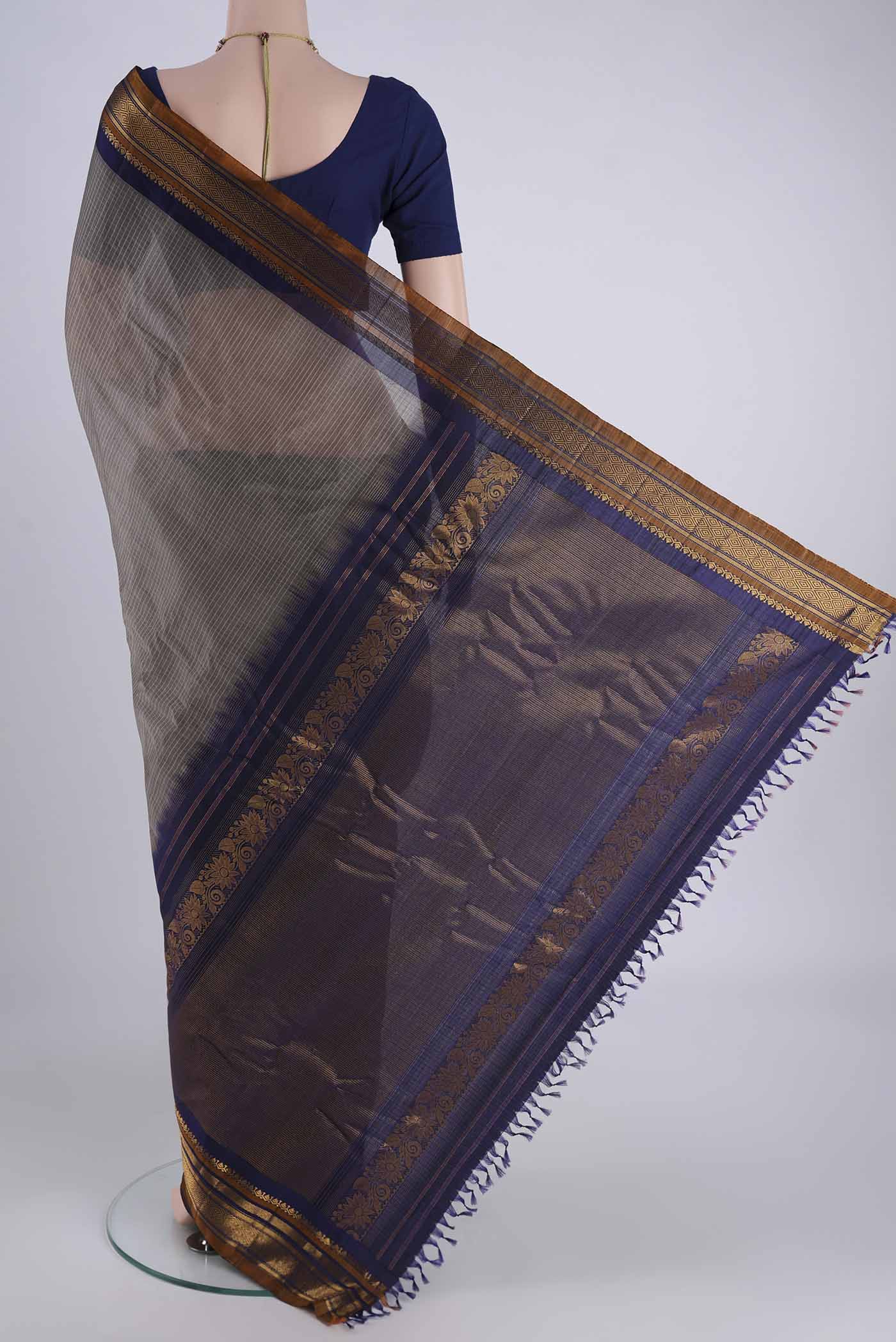 Flat view of Grey Gadwal Silk Cotton Saree with Checked design on the body and Zari Border. 