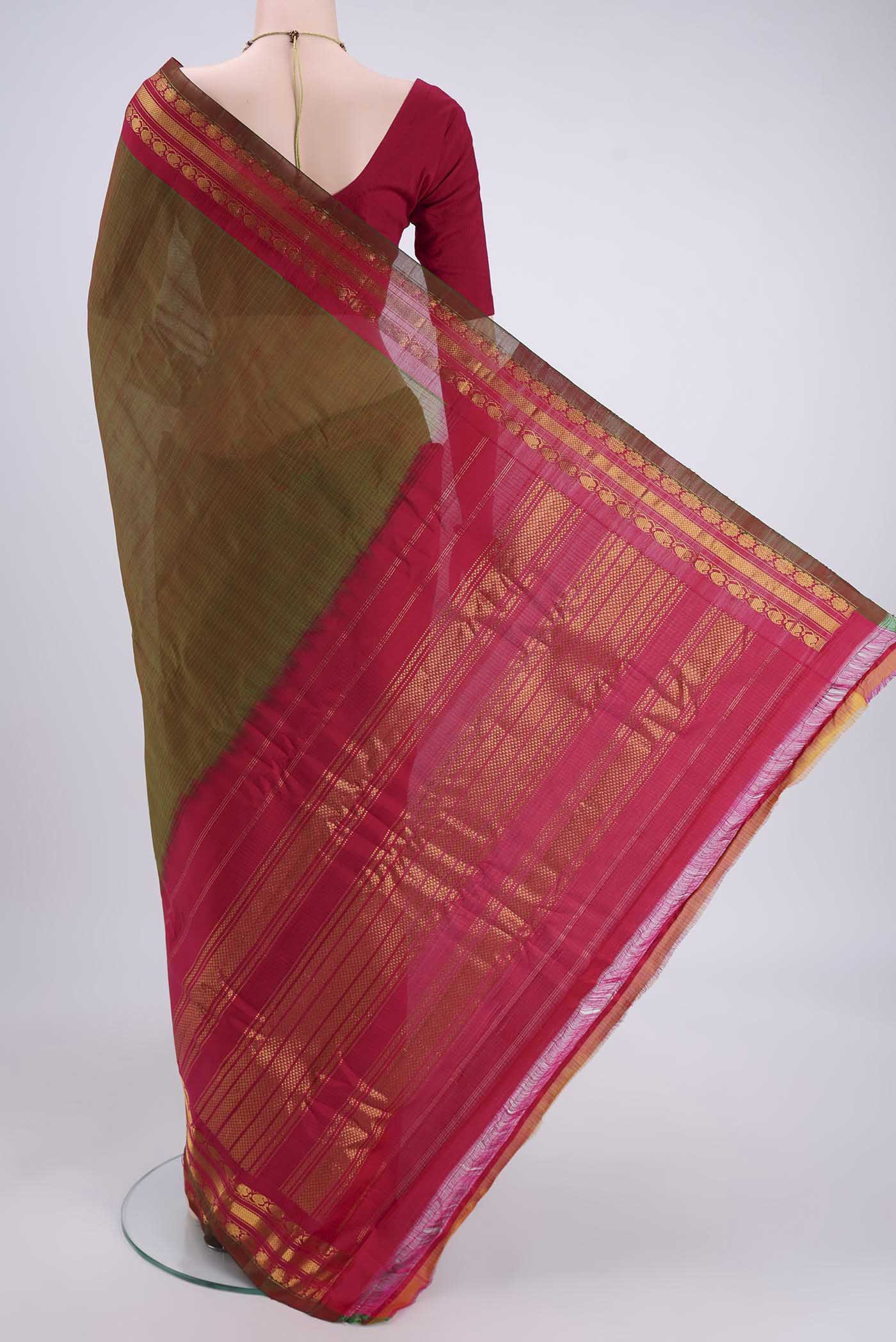 Flat view of Light Green Dual Tone Gadwal Silk Cotton Saree with Checked design on the body and Silk Border. 