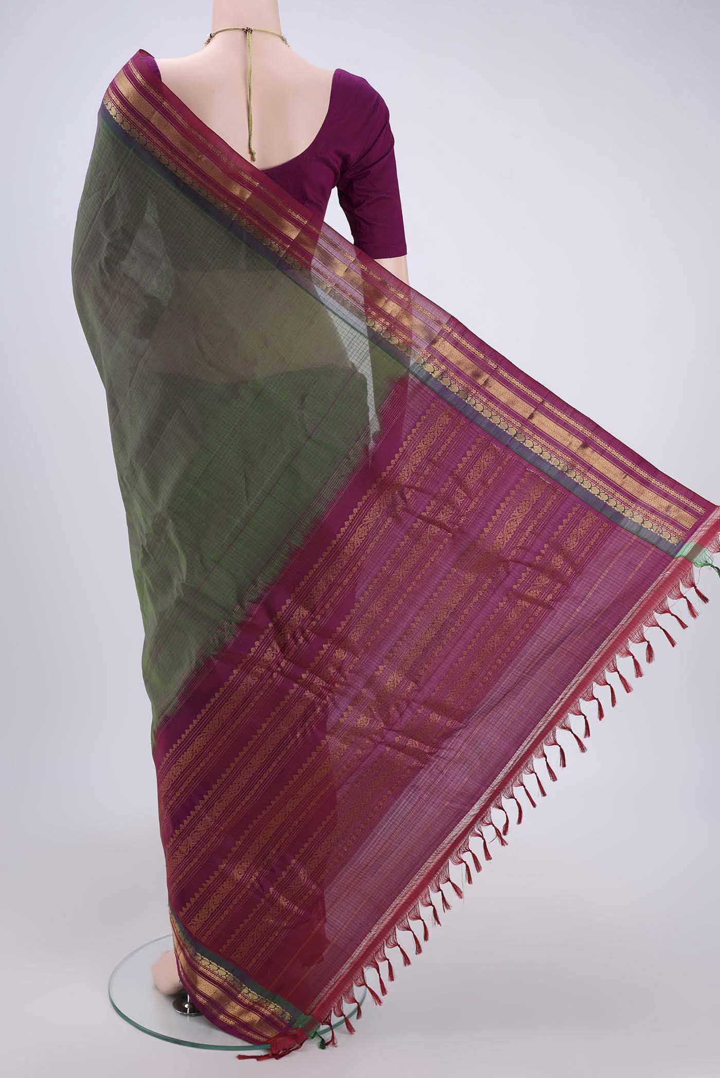Flat view of Green Gadwal Silk Cotton Saree with Stripes on the body and Silk Border. 