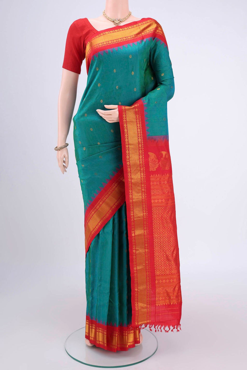 Sea Green Dual Tone Gadwal Silk Saree with Zari Butta on the body and Zari Border.  displayed on a mannequin