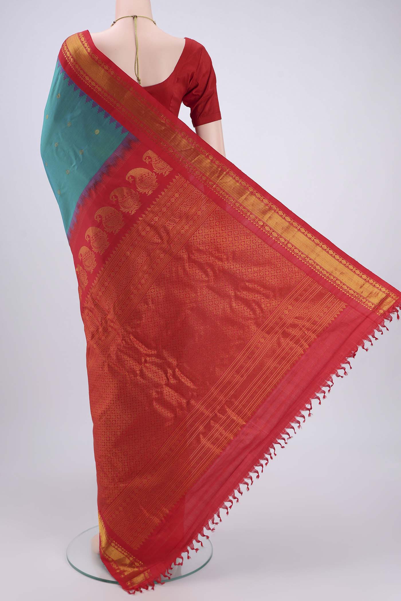 Flat view of Sea Green Dual Tone Gadwal Silk Saree with Zari Butta on the body and Zari Border. 
