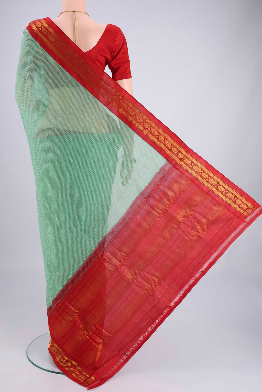 Flat view of Green Gadwal cotton Saree with Checked design on the body and Zari Border. 