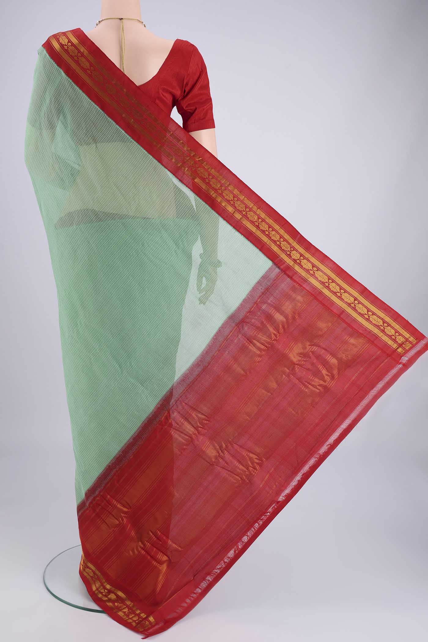 Flat view of Green Gadwal cotton Saree with Checked design on the body and Zari Border. 