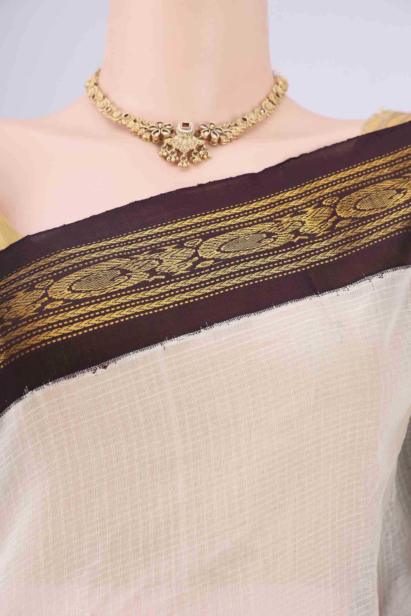 Border image of Off White Gadwal cotton Saree with Checked design on the body and Zari Border. 