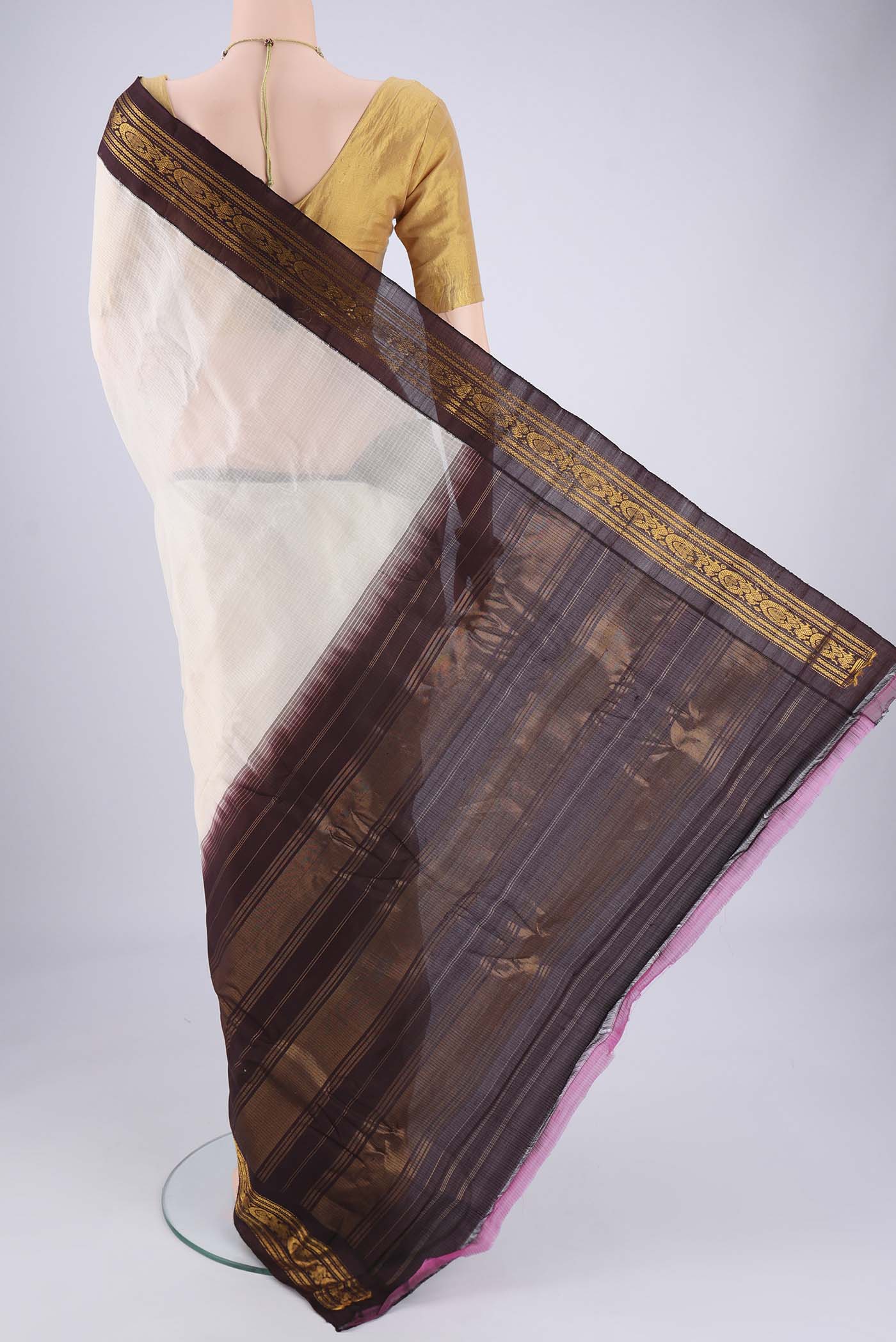 Flat view of Off White Gadwal cotton Saree with Checked design on the body and Zari Border. 