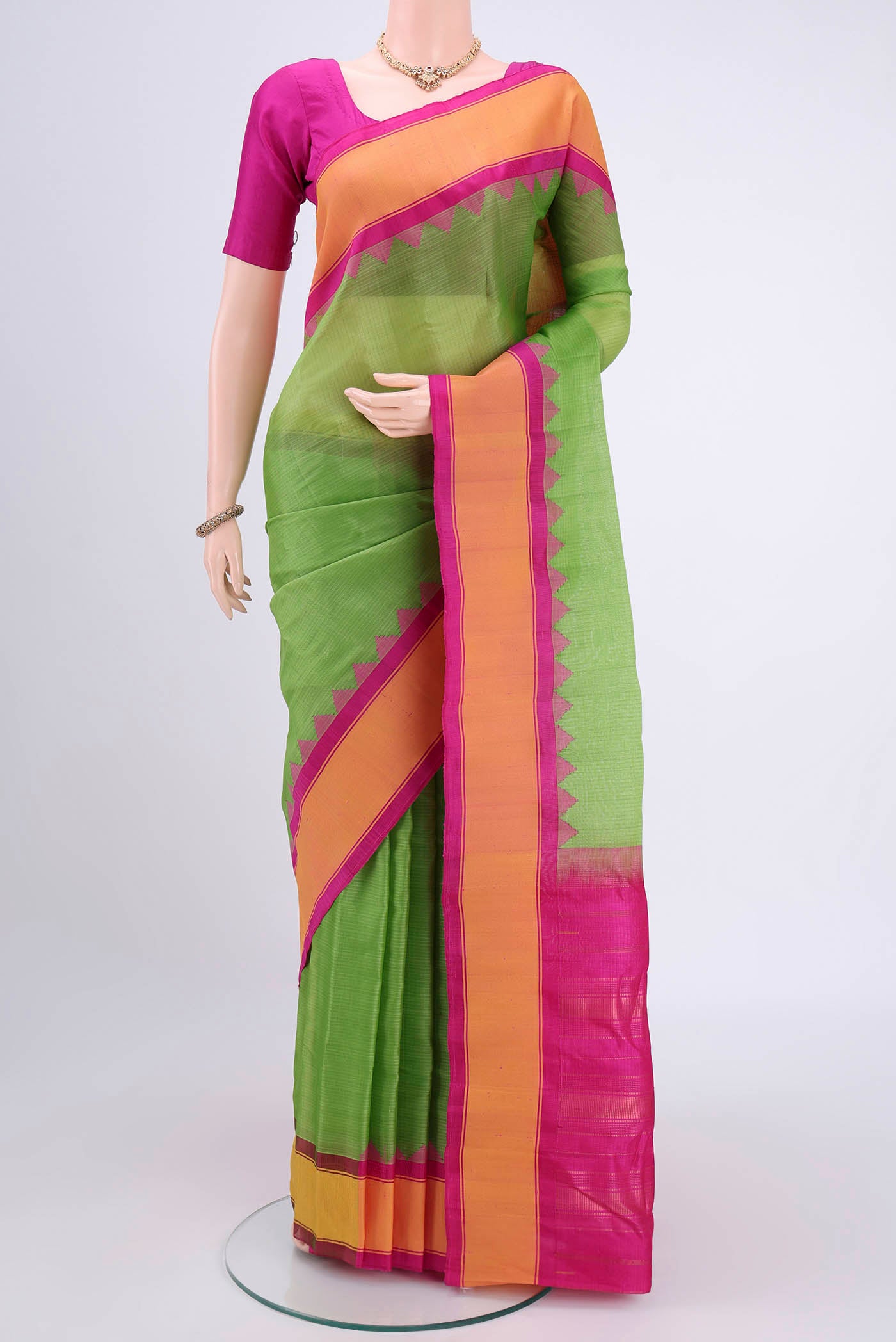 Parrot Green Gadwal Silk Saree with Checked design on the body and Zari Border.  displayed on a mannequin