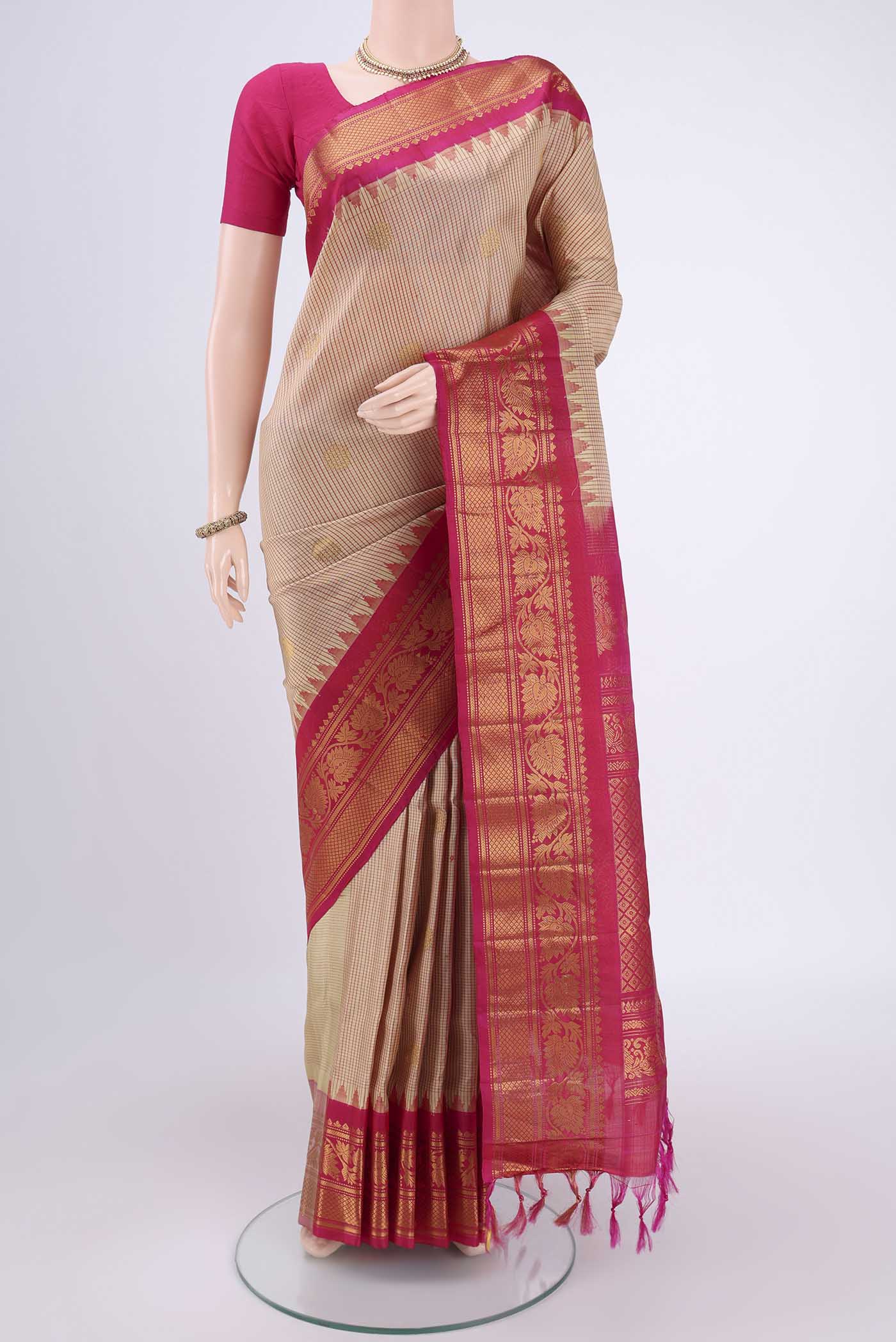Beige Gadwal Silk Saree with Checked design on the body and Zari Border.  displayed on a mannequin