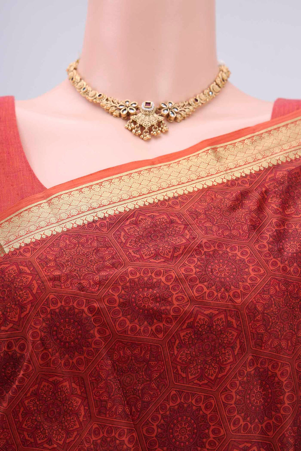 Border image of Brick Orange Printed Silk Saree with Printed design on the body and Zari Border. 