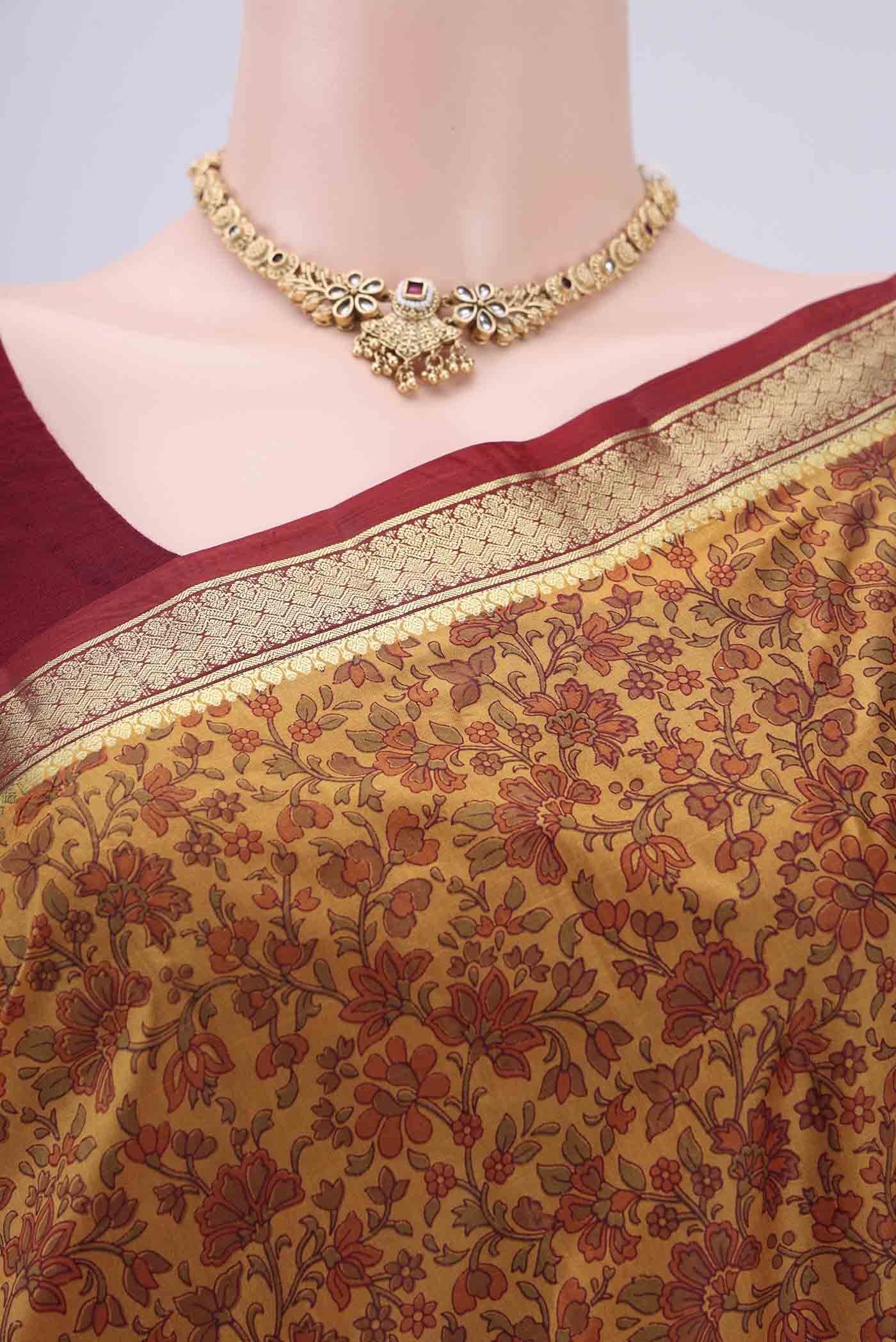 Border image of Mustard Printed Silk Saree with Printed design on the body and Zari Border. 