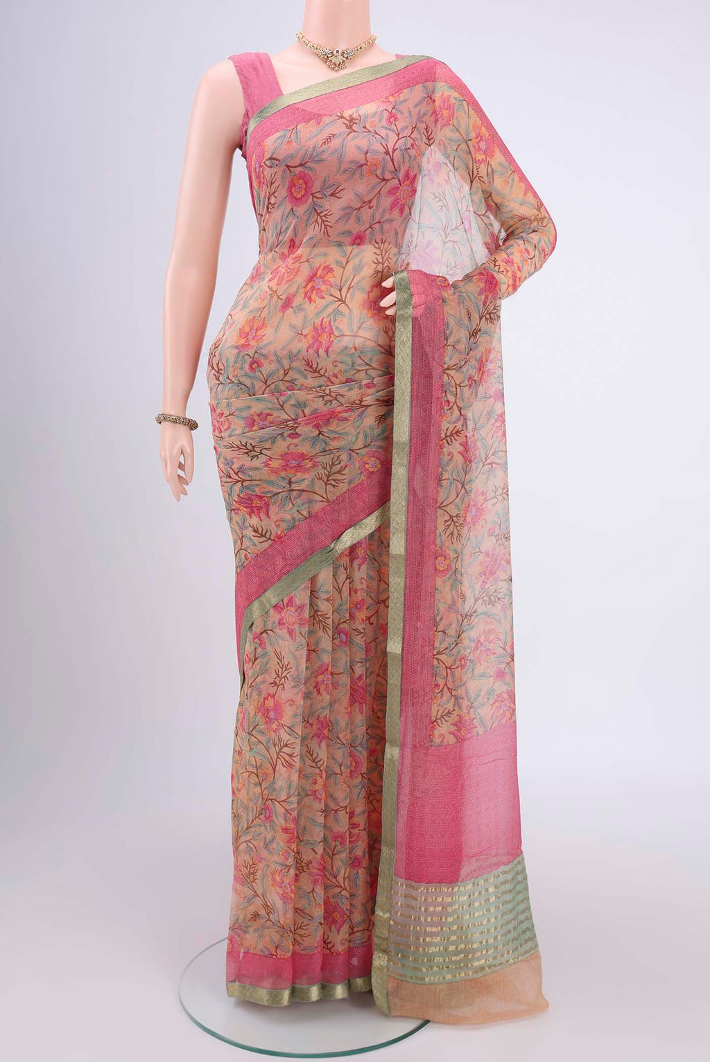 Peach Mysore Chiffon Saree with Floral Print on the body and Satin Border.  displayed on a mannequin