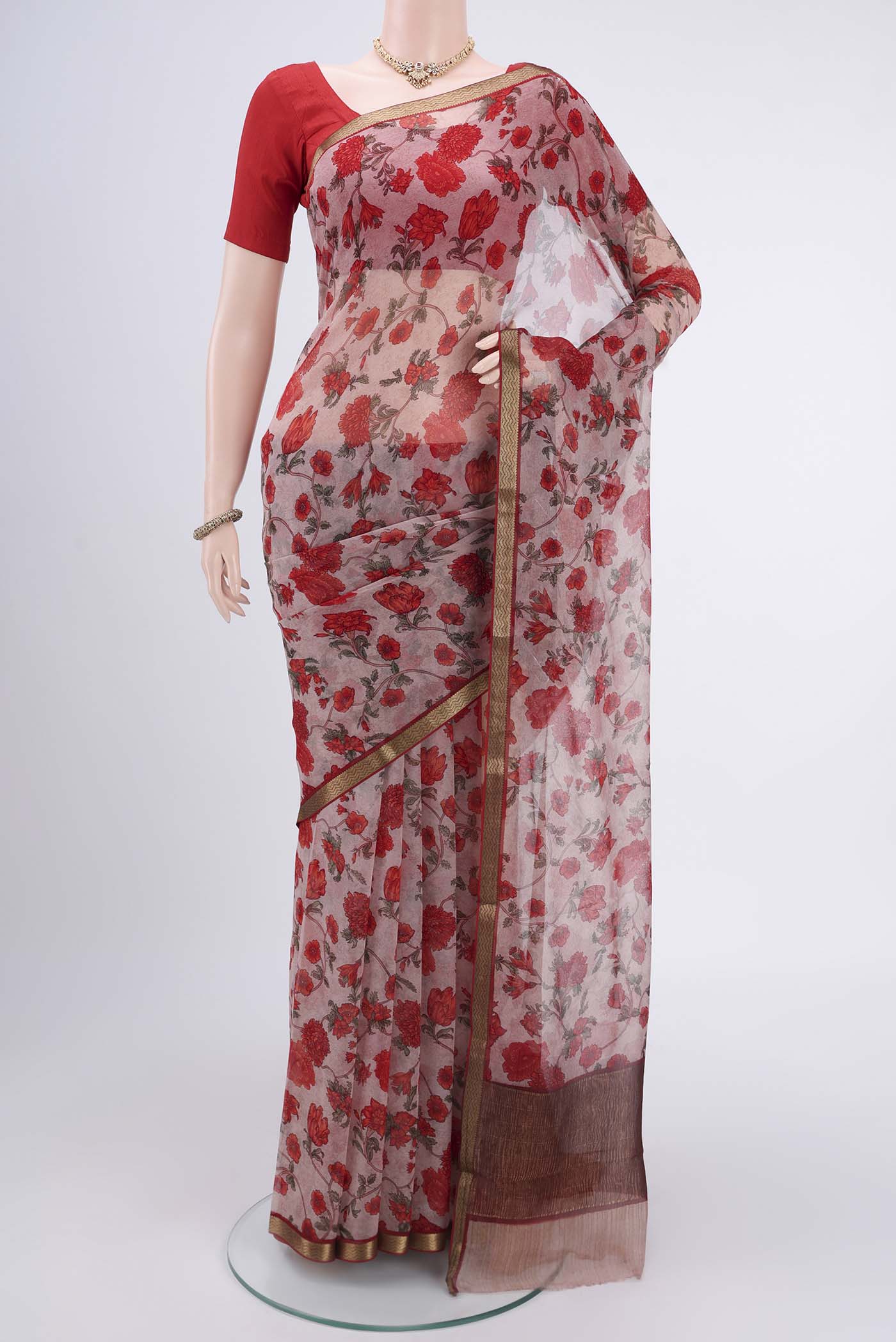 Pink Mysore Chiffon Saree with Floral Print on the body and Zari Border.  displayed on a mannequin