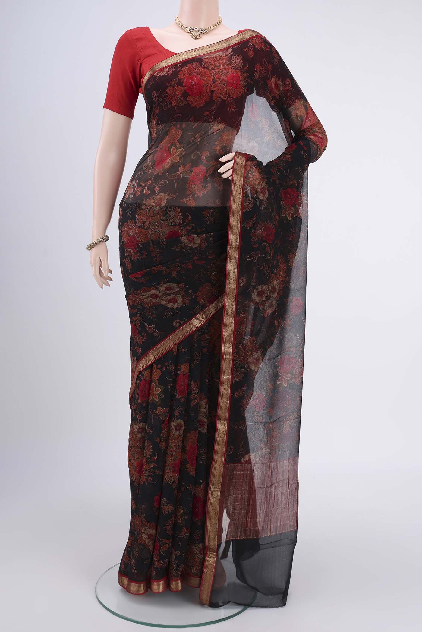 Black Mysore Chiffon Saree with Floral Print on the body and Zari Border.  displayed on a mannequin