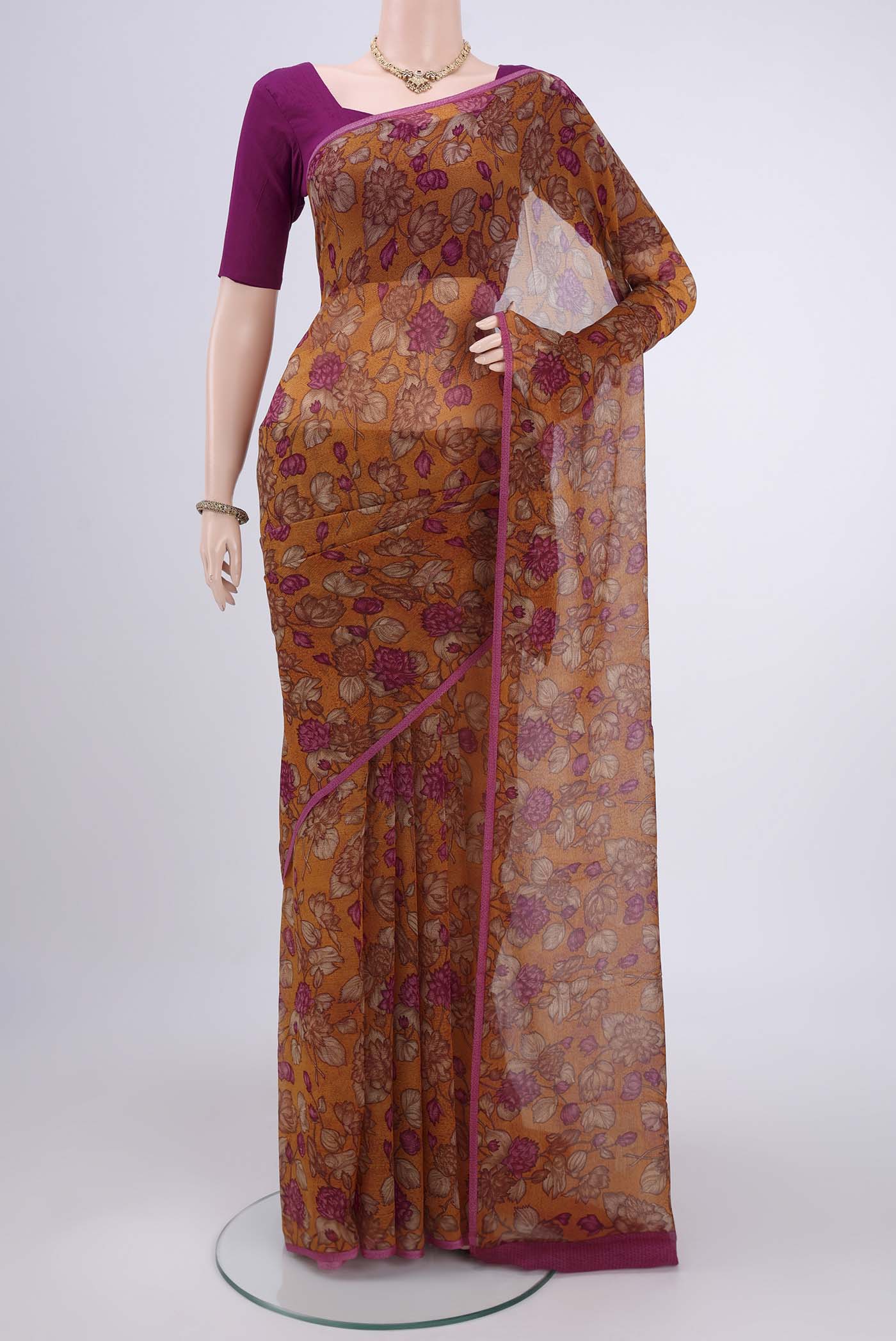 Mustard Mysore Chiffon Saree with Floral Print on the body and Without Border.  displayed on a mannequin