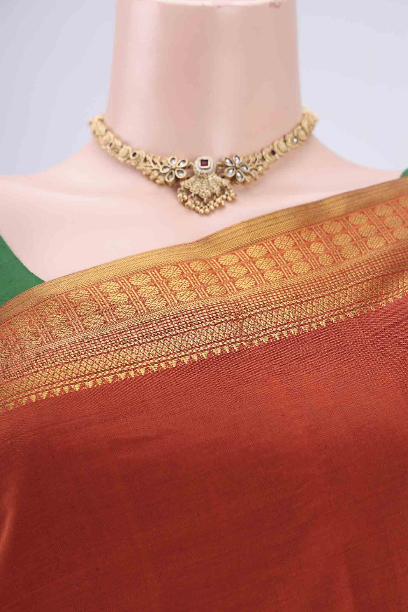 Border image of Rust Blended Poly Cotton Saree with Plain Body and Zari Border. 
