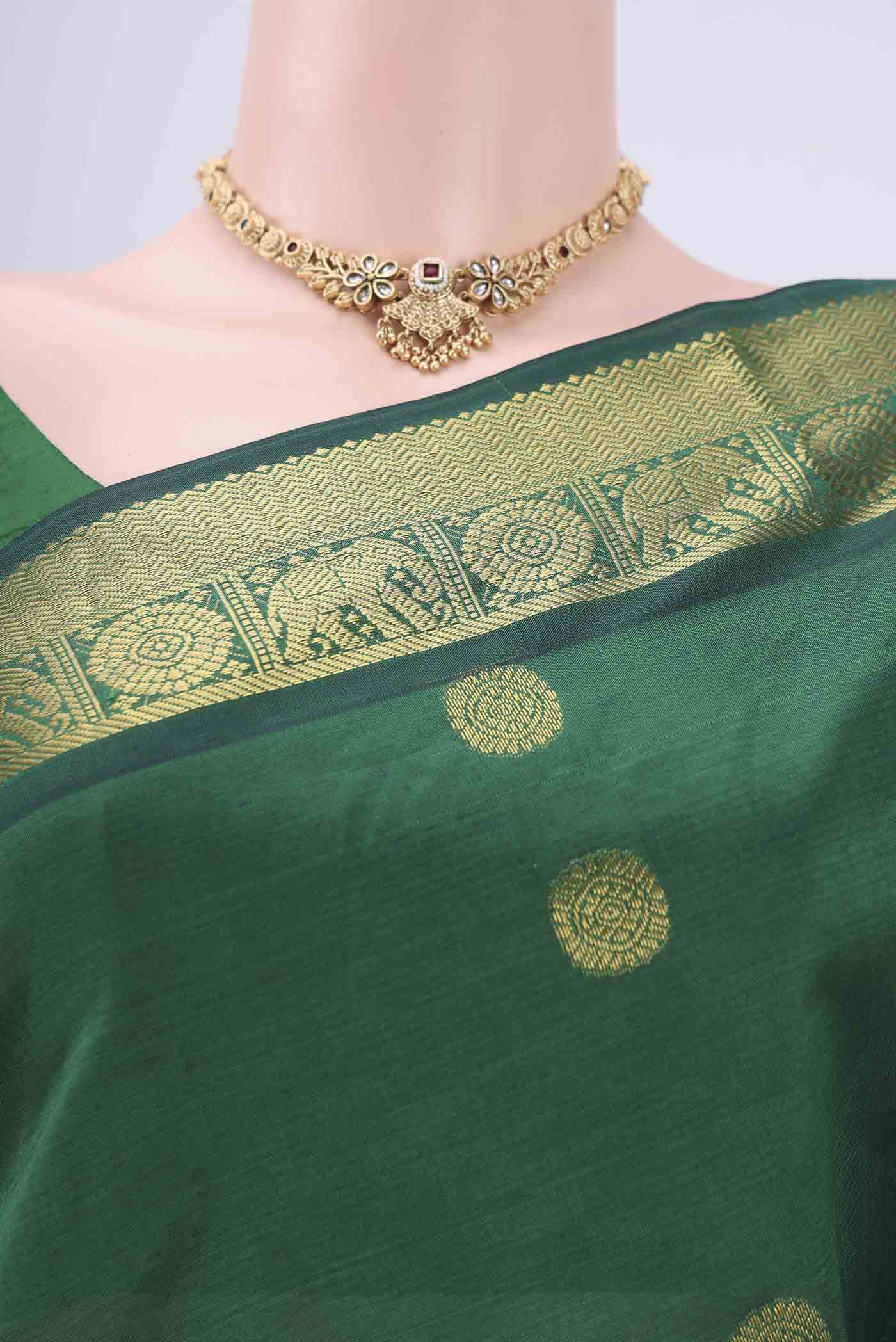 Border image of Bottle Green Blended Poly Cotton Saree with Zari Butta on the body and Zari Border. 