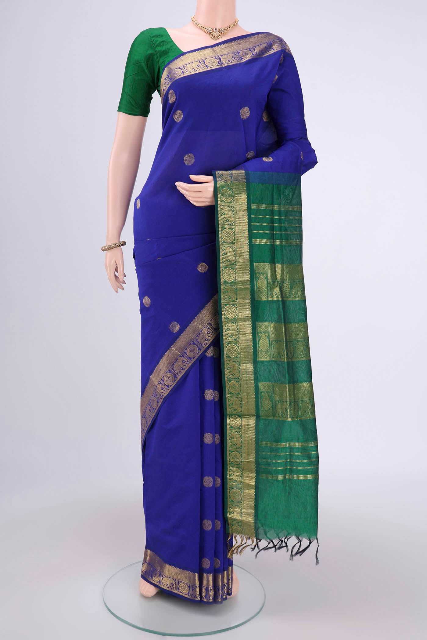 Royal Blue Blended Poly Cotton Saree with Zari Butta on the body and Zari Border.  displayed on a mannequin