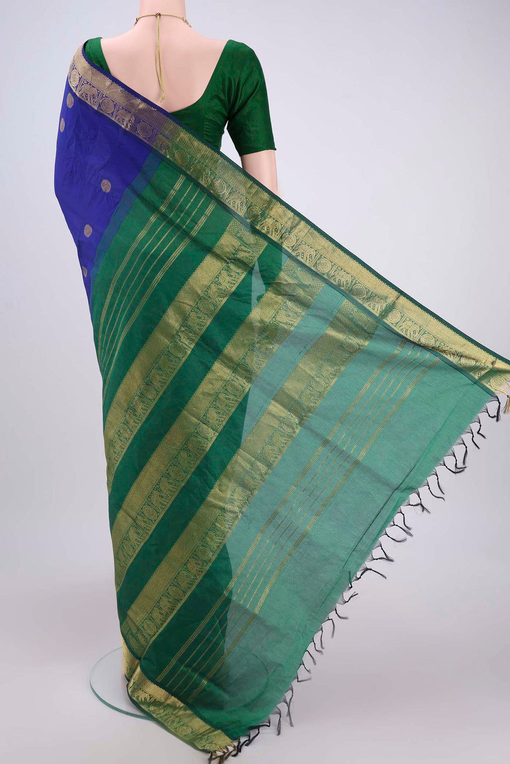 Flat view of Royal Blue Blended Poly Cotton Saree with Zari Butta on the body and Zari Border. 