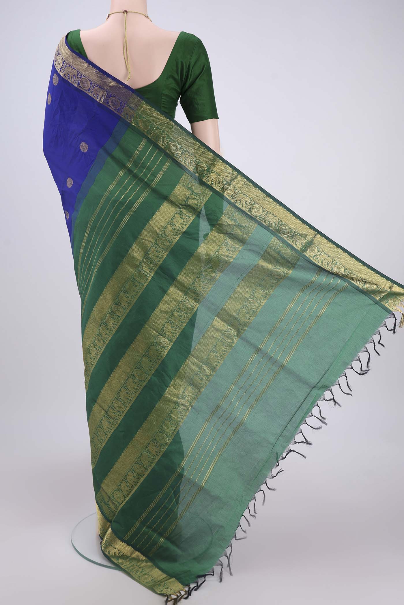 Flat view of Royal Blue Blended Poly Cotton Saree with Zari Butta on the body and Zari Border. 