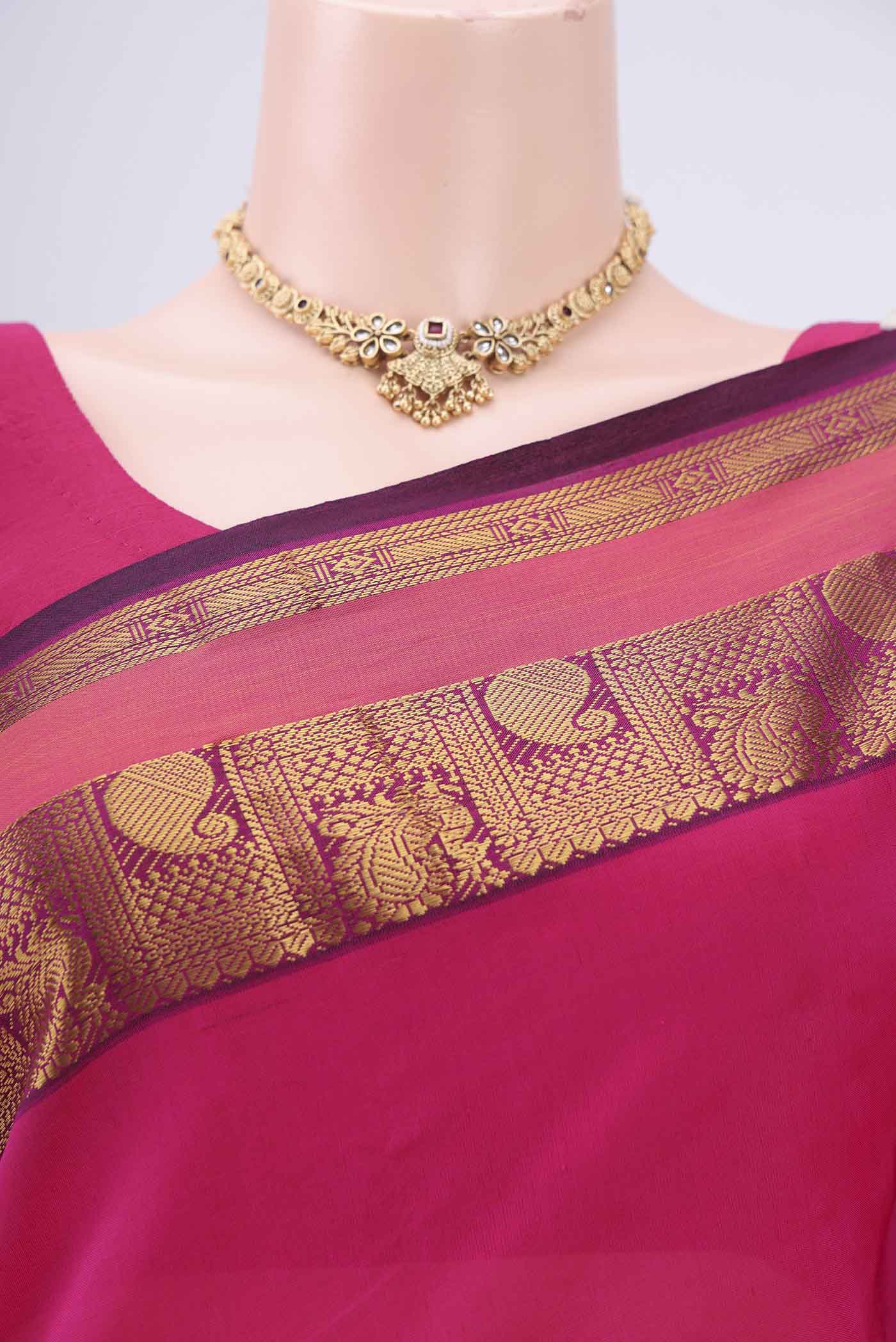 Border image of Rani Pink Blended Poly Cotton Saree with Plain Body and Zari Border. 