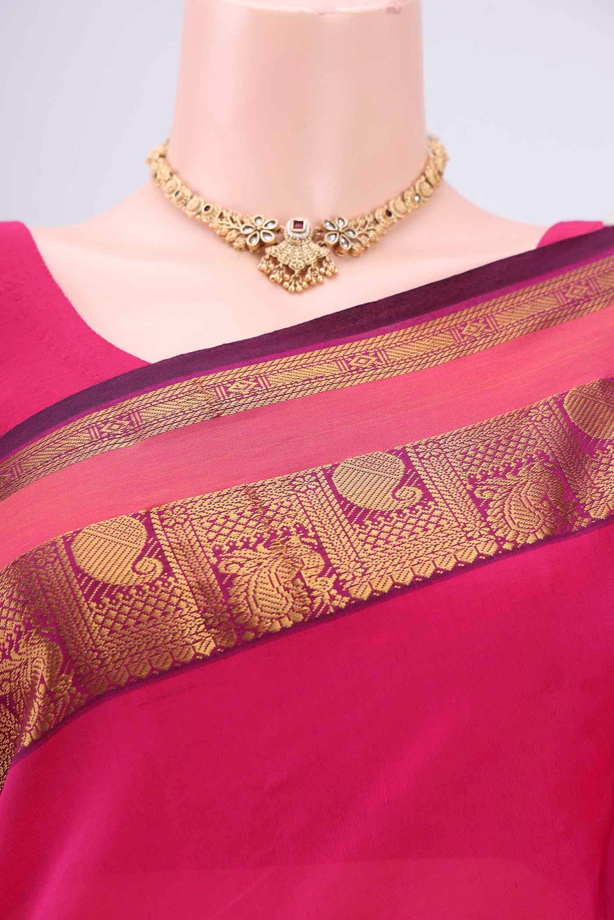 Border image of Rani Pink Blended Poly Cotton Saree with Plain Body and Zari Border. 