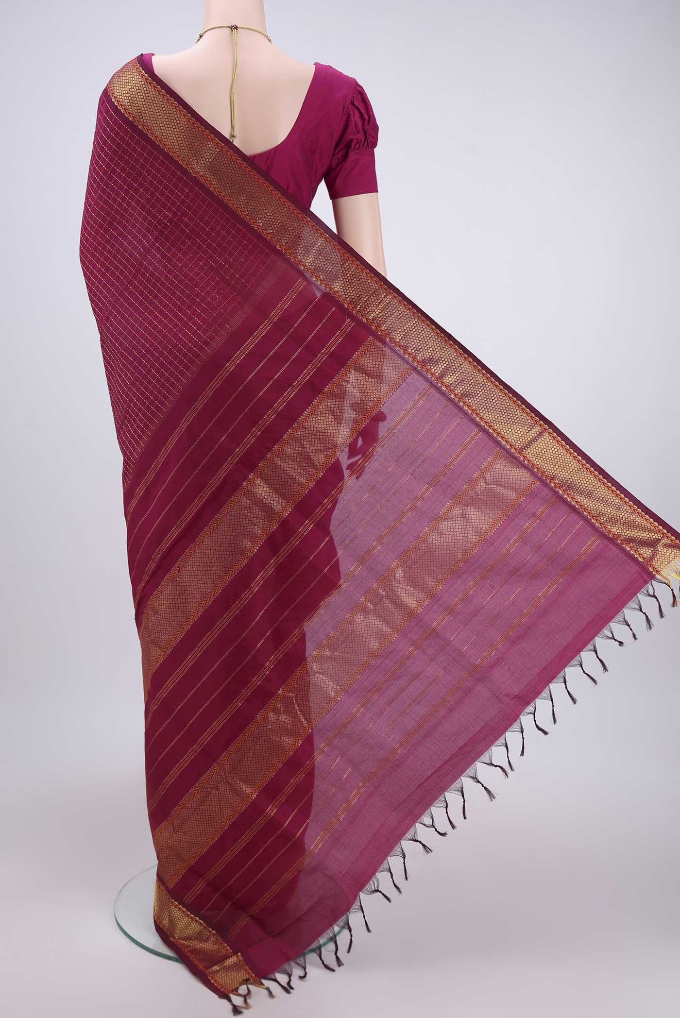 Flat view of Magenta Blended Poly Cotton Saree with Checked design on the body and Zari Border. 