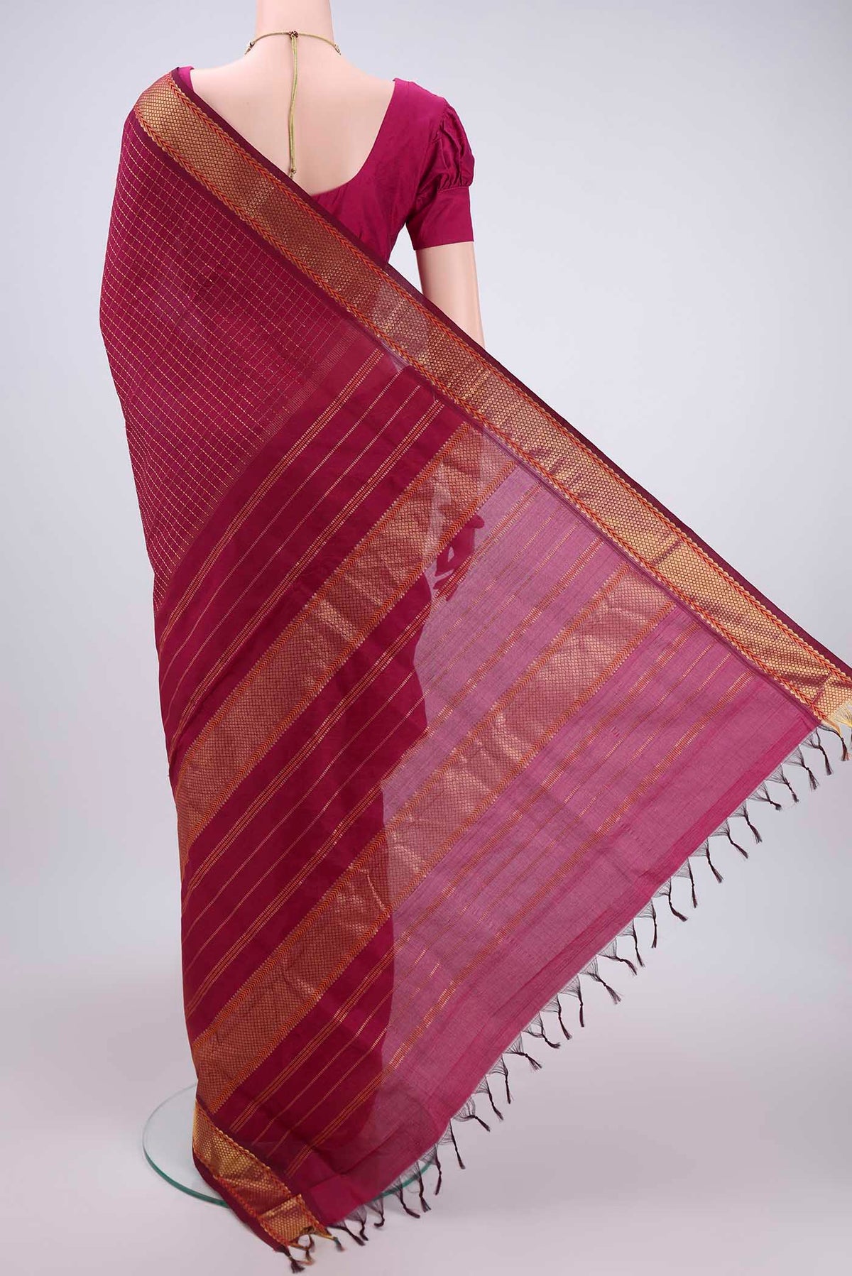 Flat view of Magenta Blended Poly Cotton Saree with Checked design on the body and Zari Border. 
