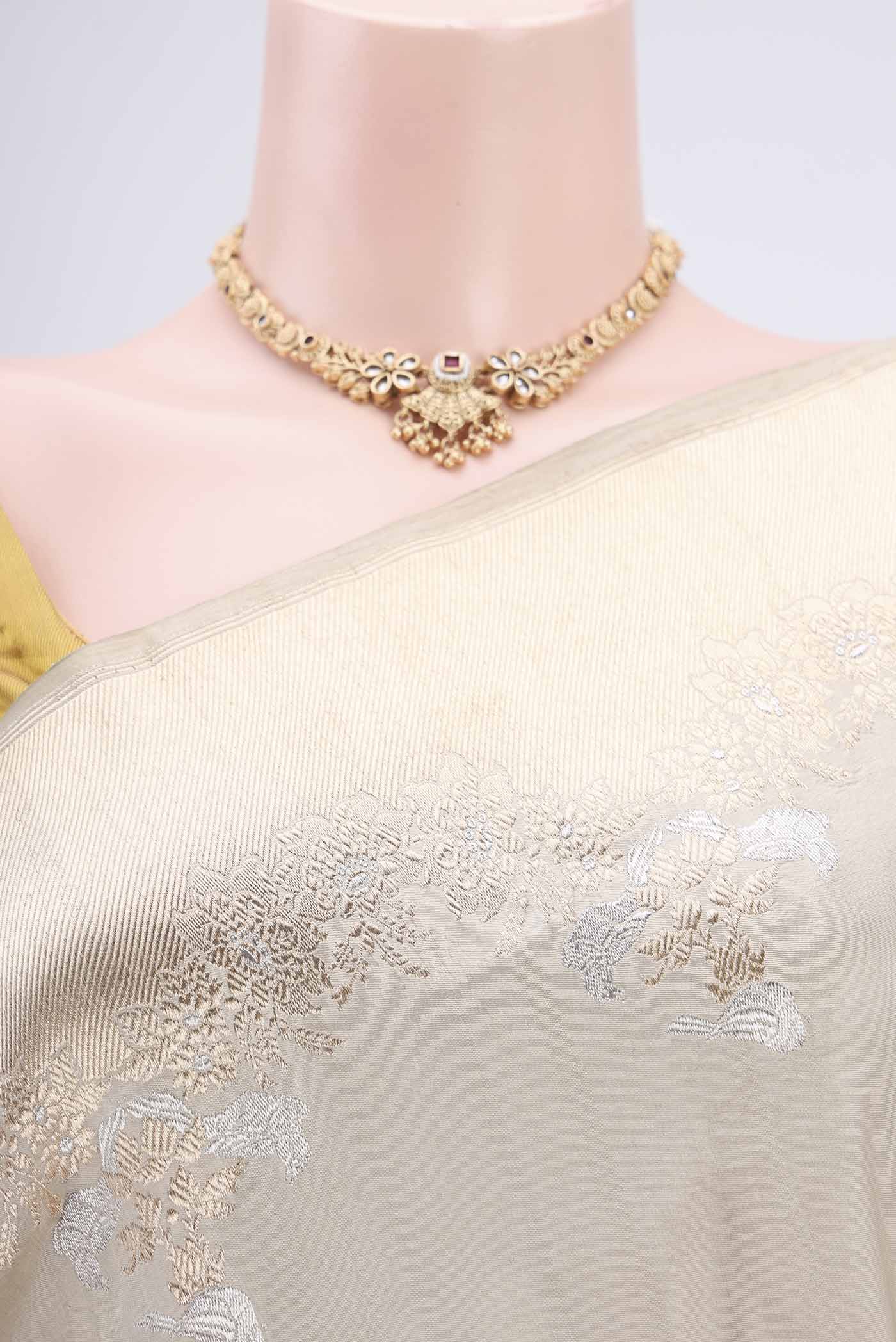 Border image of Beige Banarasi Silk Saree with Zari Butta on the body and Zari Border. 