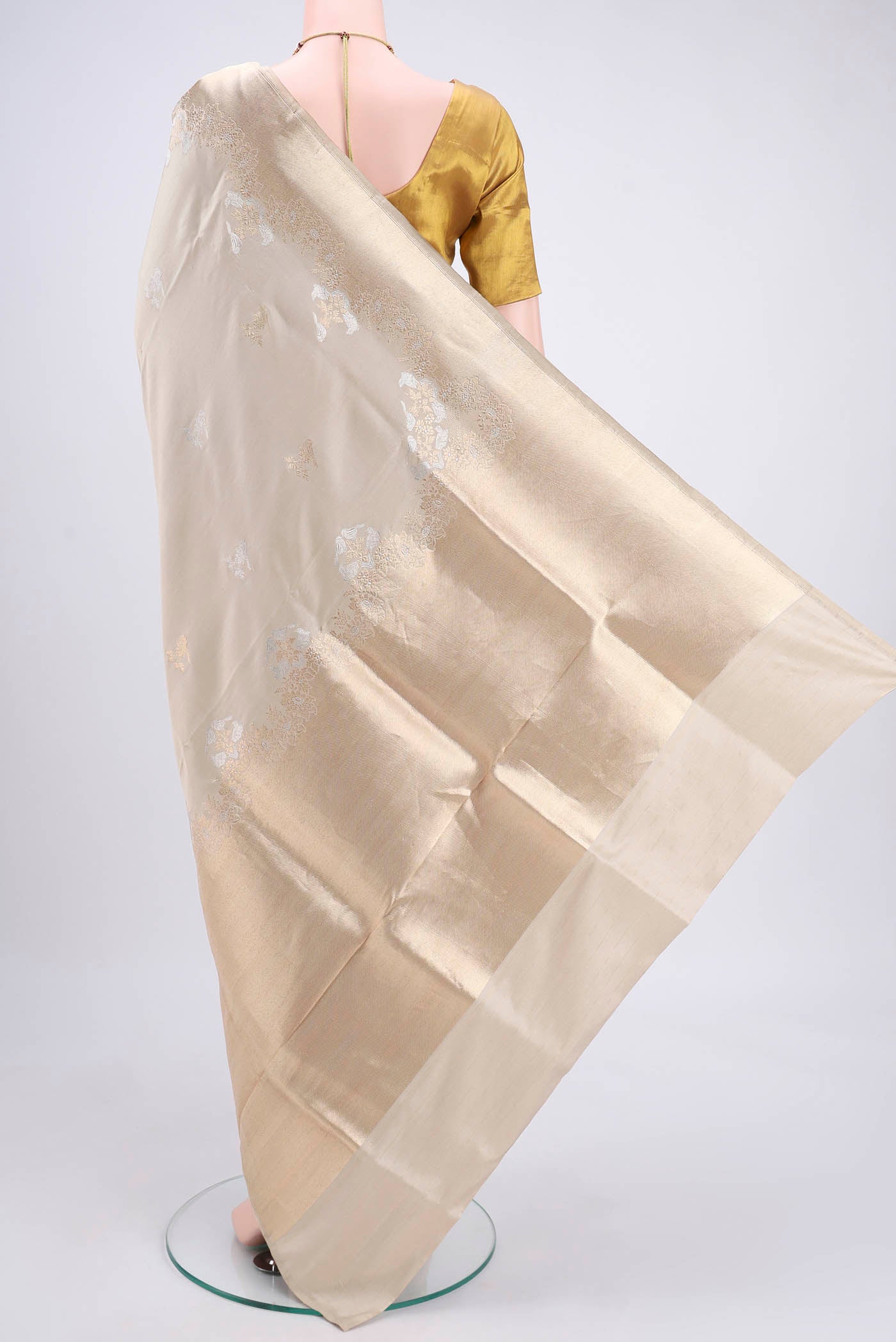 Flat view of Beige Banarasi Silk Saree with Zari Butta on the body and Zari Border. 