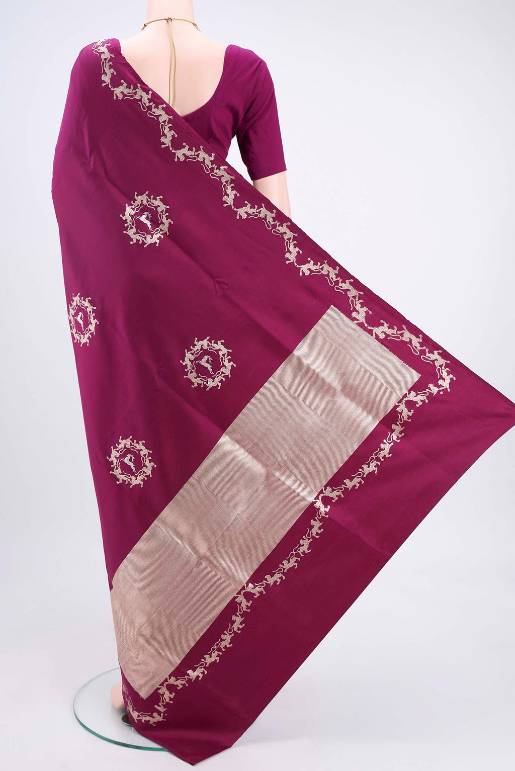 Flat view of Magenta Banarasi Silk Saree with Zari Butta on the body and Zari Border. 