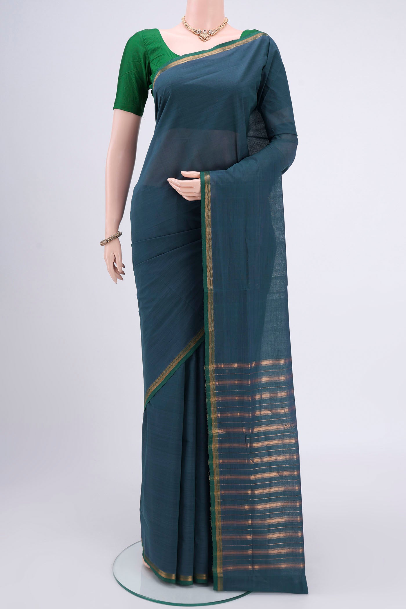 Peacock Blue Mangalagiri Cotton Saree with Plain Body and Zari Border.  displayed on a mannequin