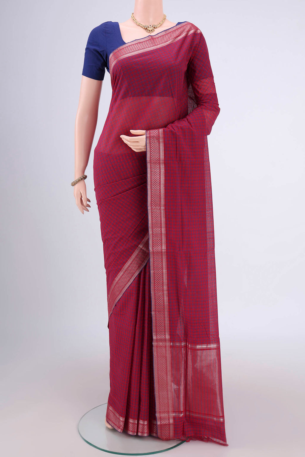 Red Mangalagiri Cotton Saree with Checked design on the body and Zari Border.  displayed on a mannequin